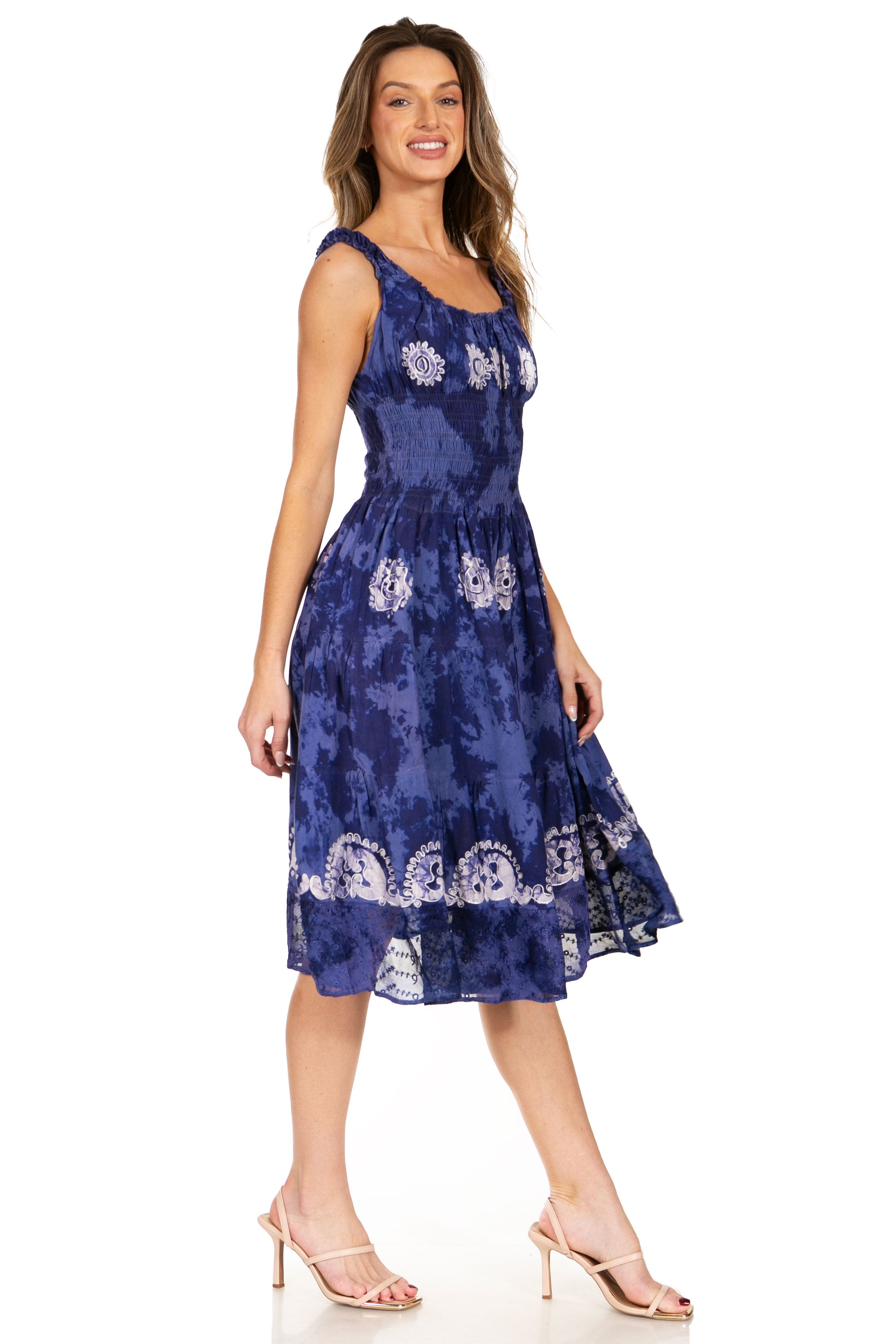 Woman wearing a blue floral dress on a white background