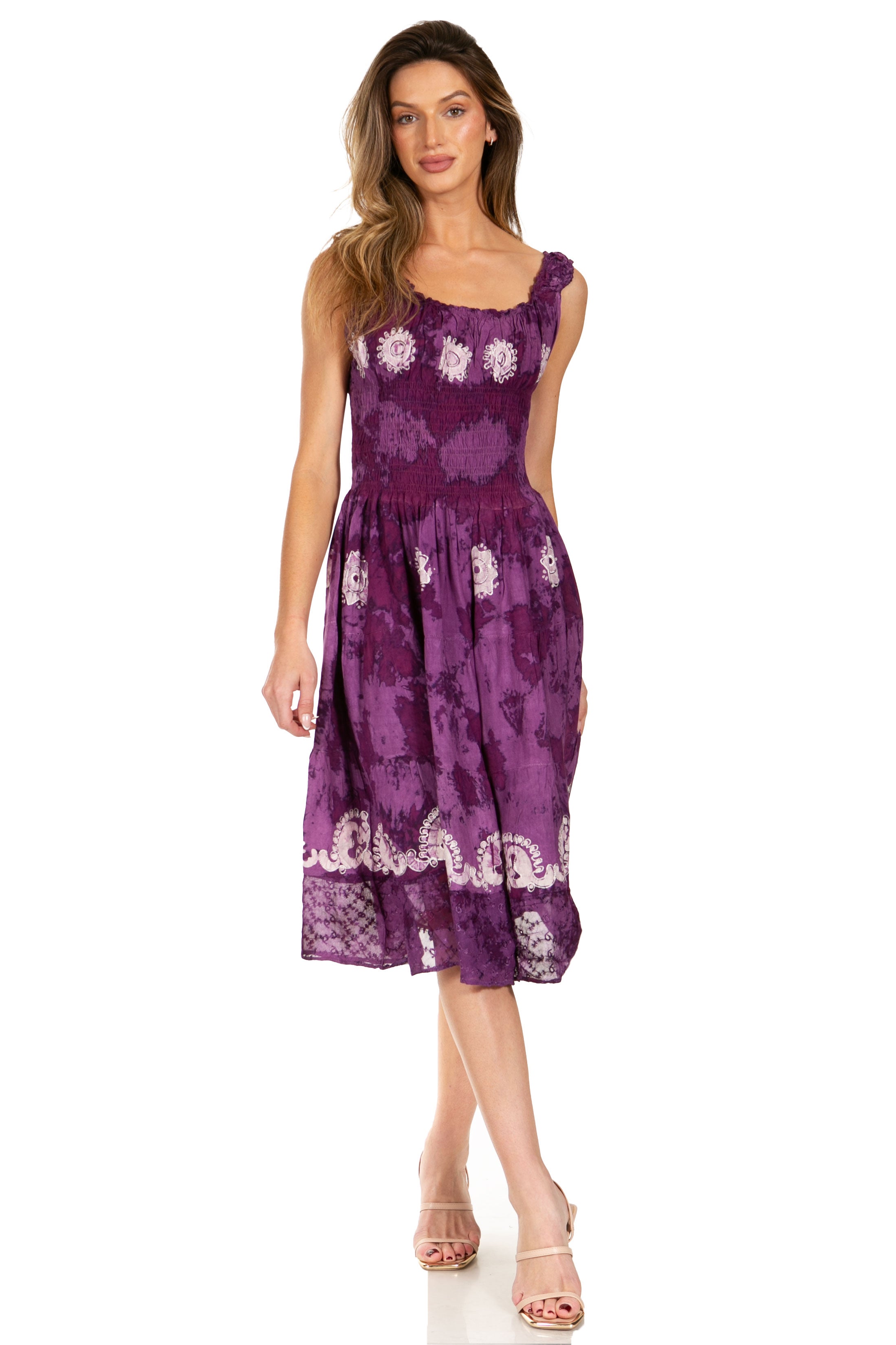 Woman wearing a purple floral dress on a white background