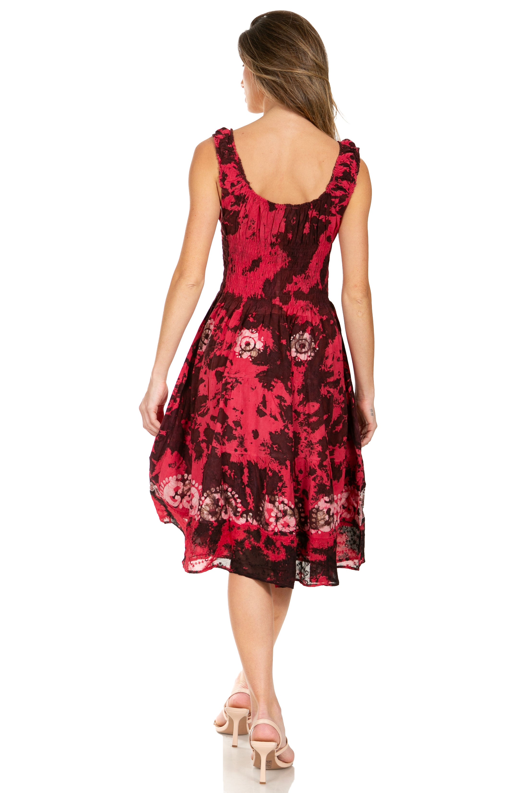 Woman wearing a red and black floral dress on a white background