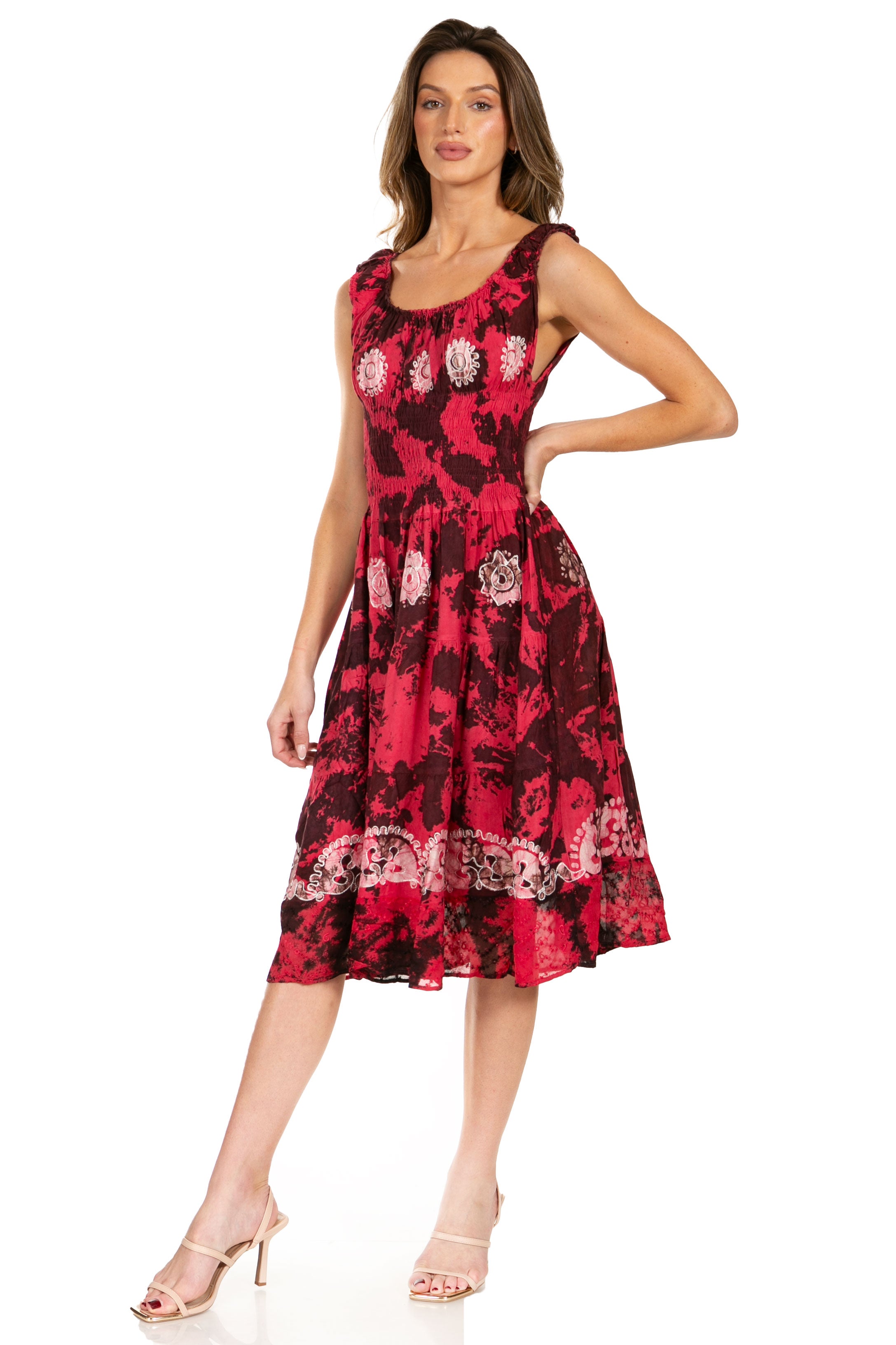 Woman wearing a red floral dress on a white background