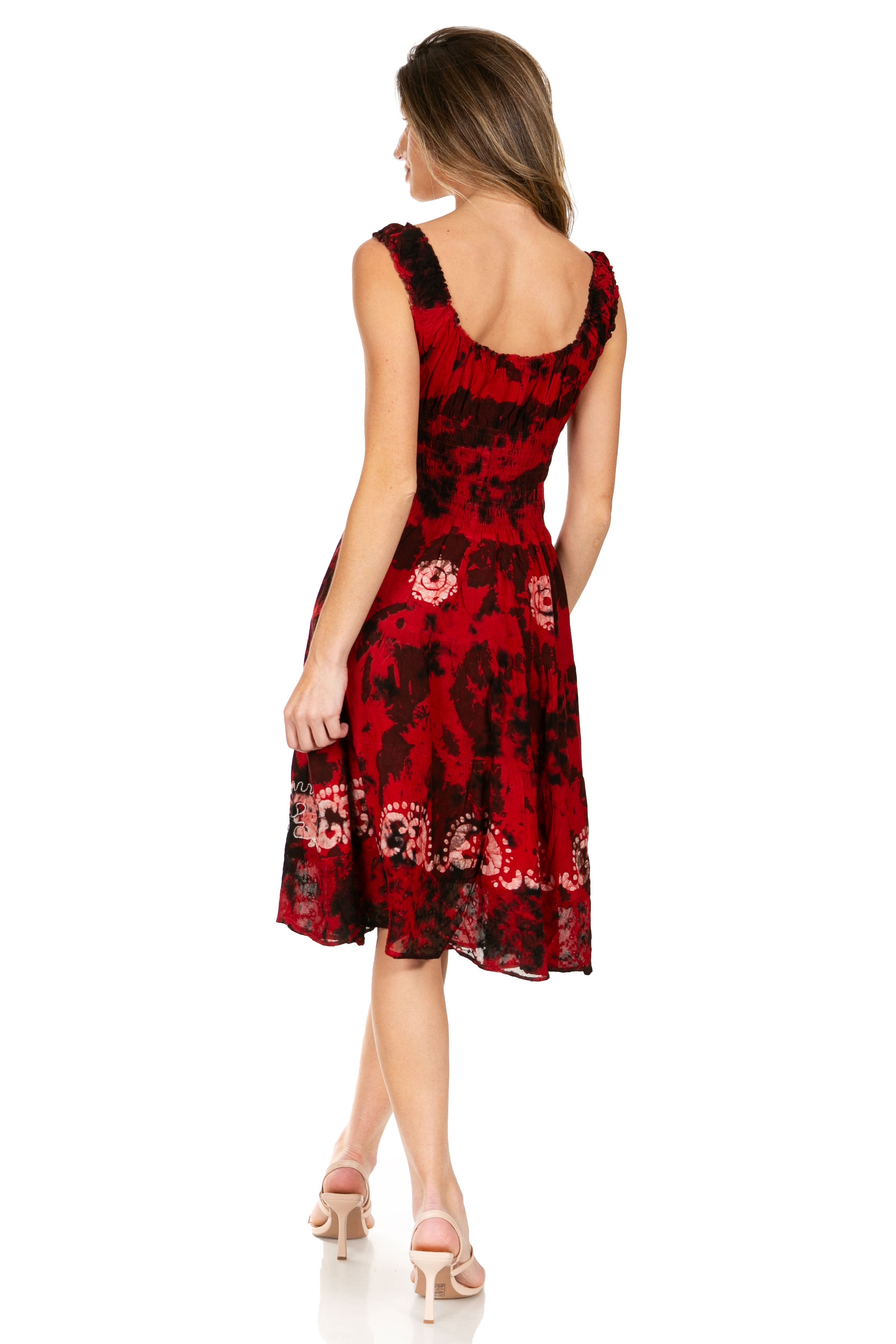 Woman wearing a red floral dress on a white background