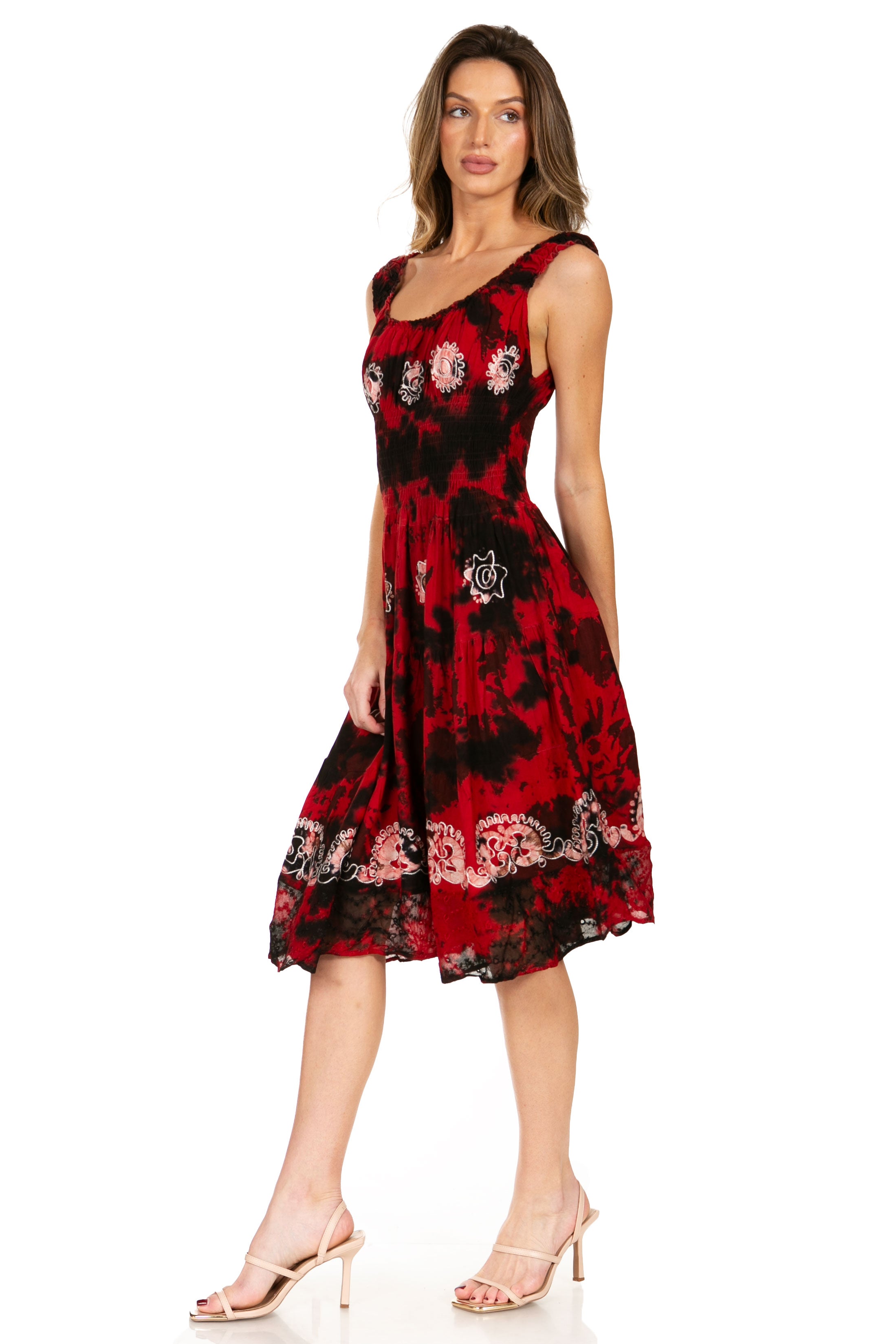 Woman wearing a red and black floral dress on a white background