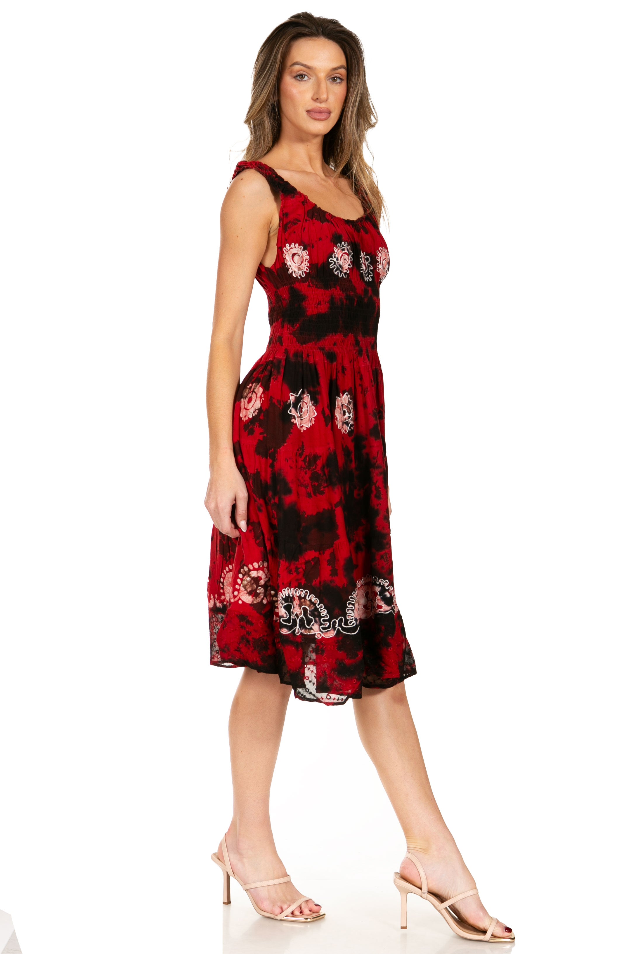 Woman wearing a red floral dress on a white background