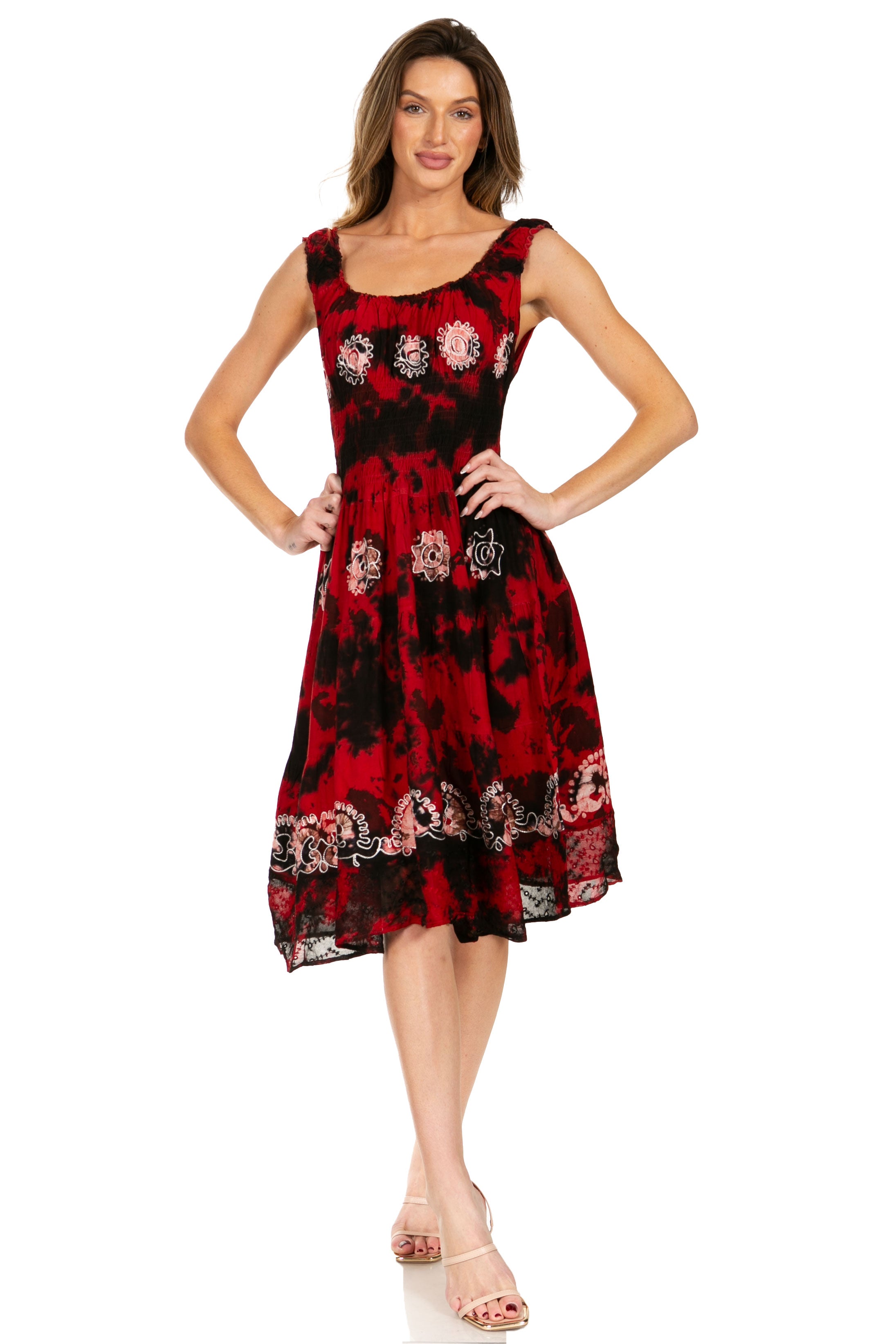 Woman wearing a red and black patterned dress on a white background