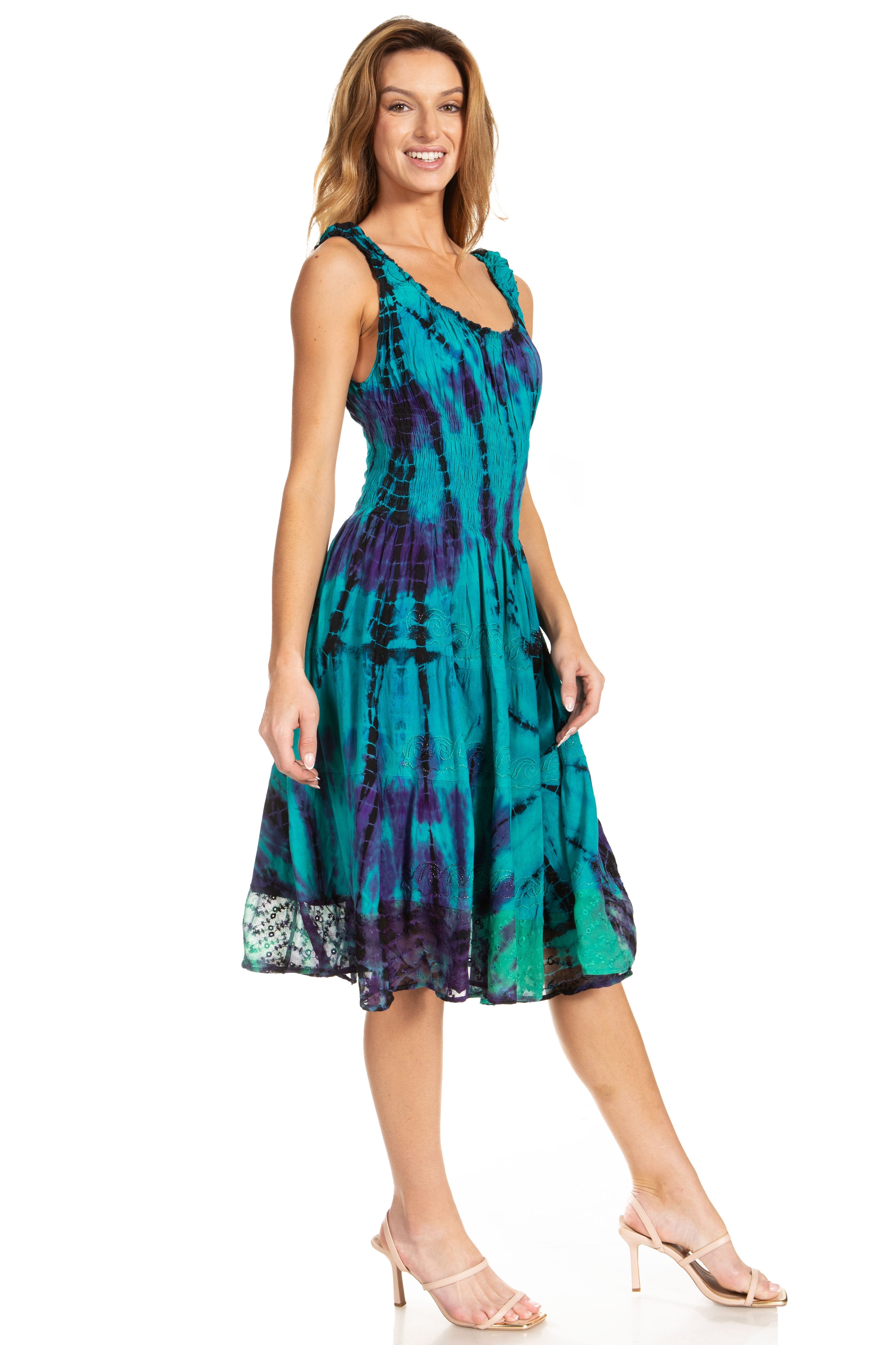 Woman wearing a tie-dye dress on a white background