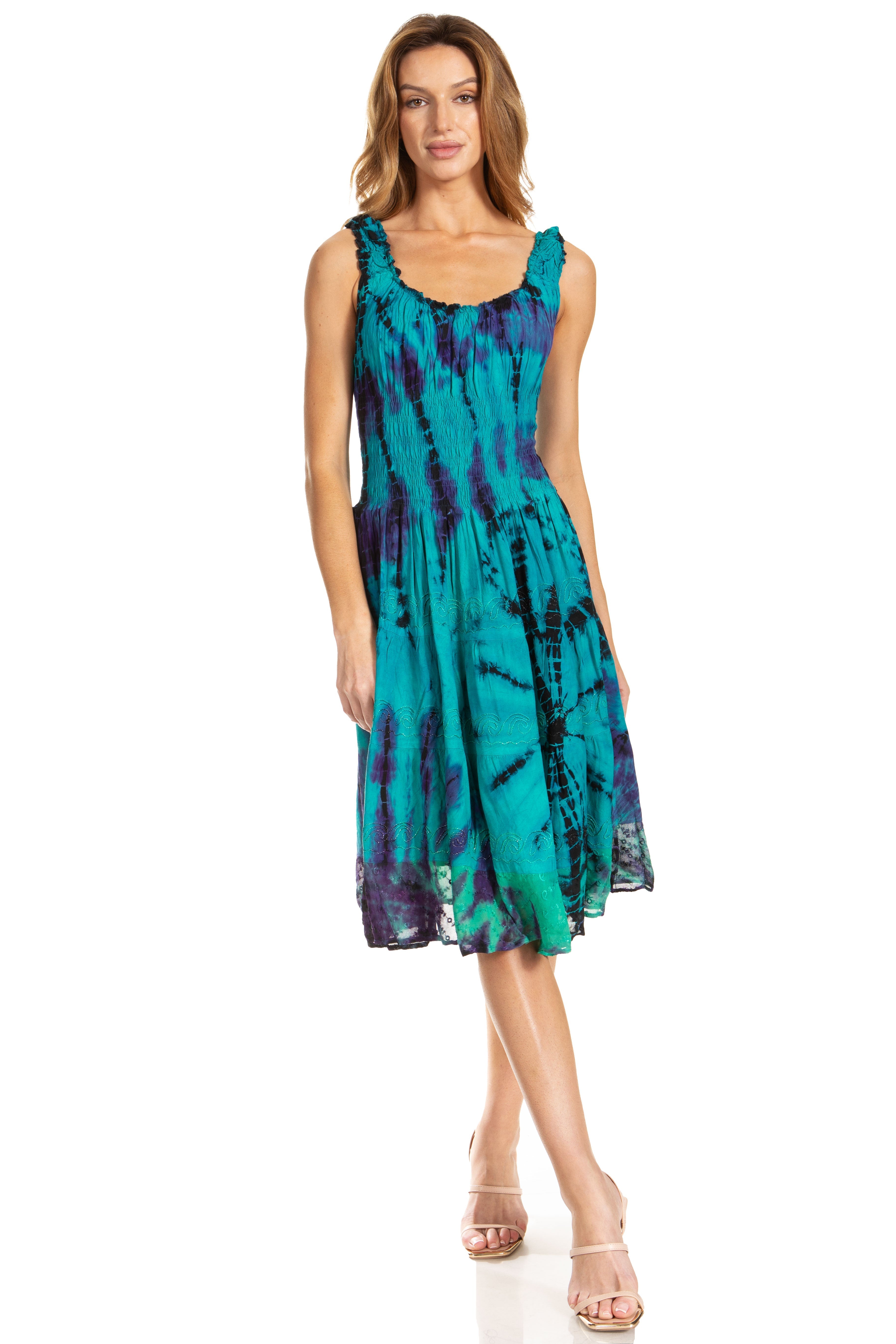 Woman wearing a tie-dye dress on a white background