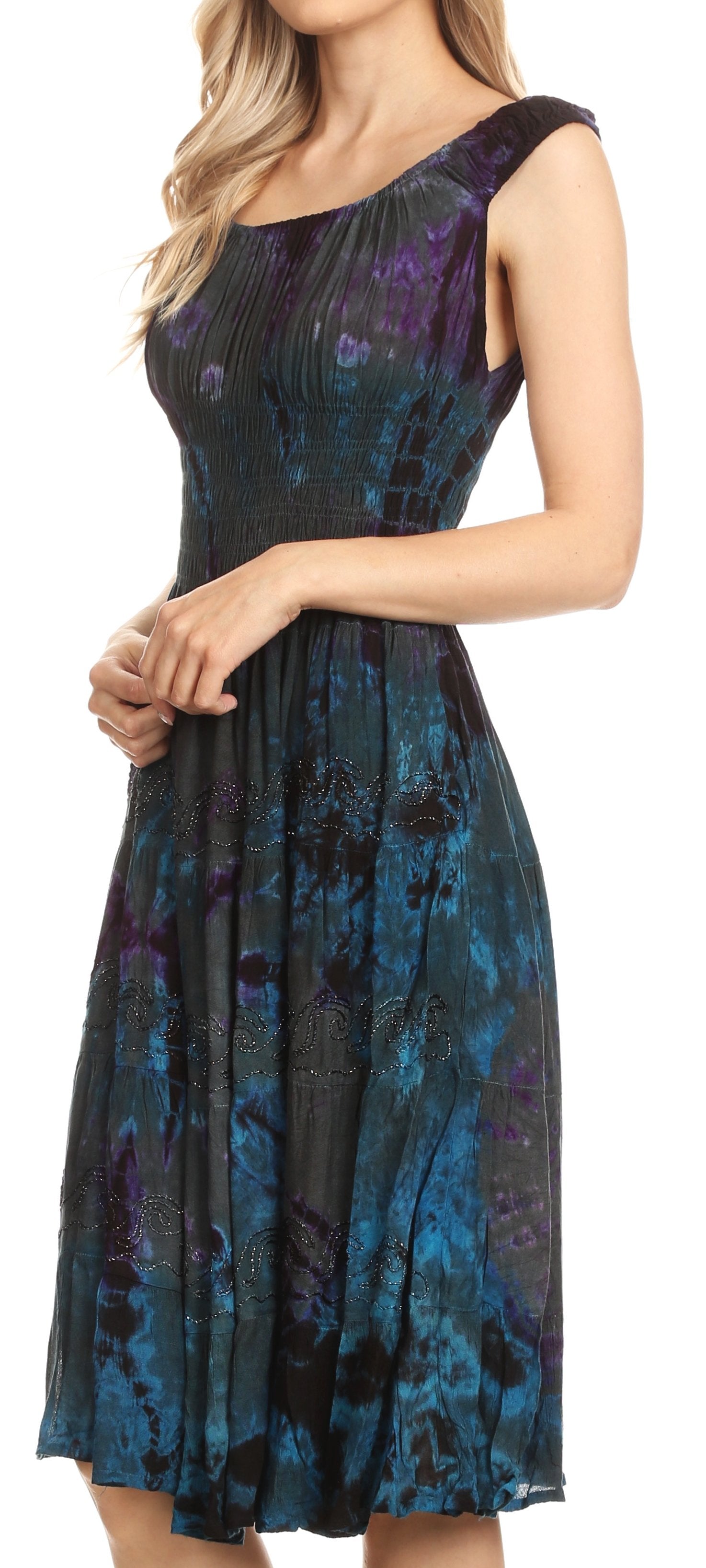 Woman wearing a blue and black patterned dress on a white background