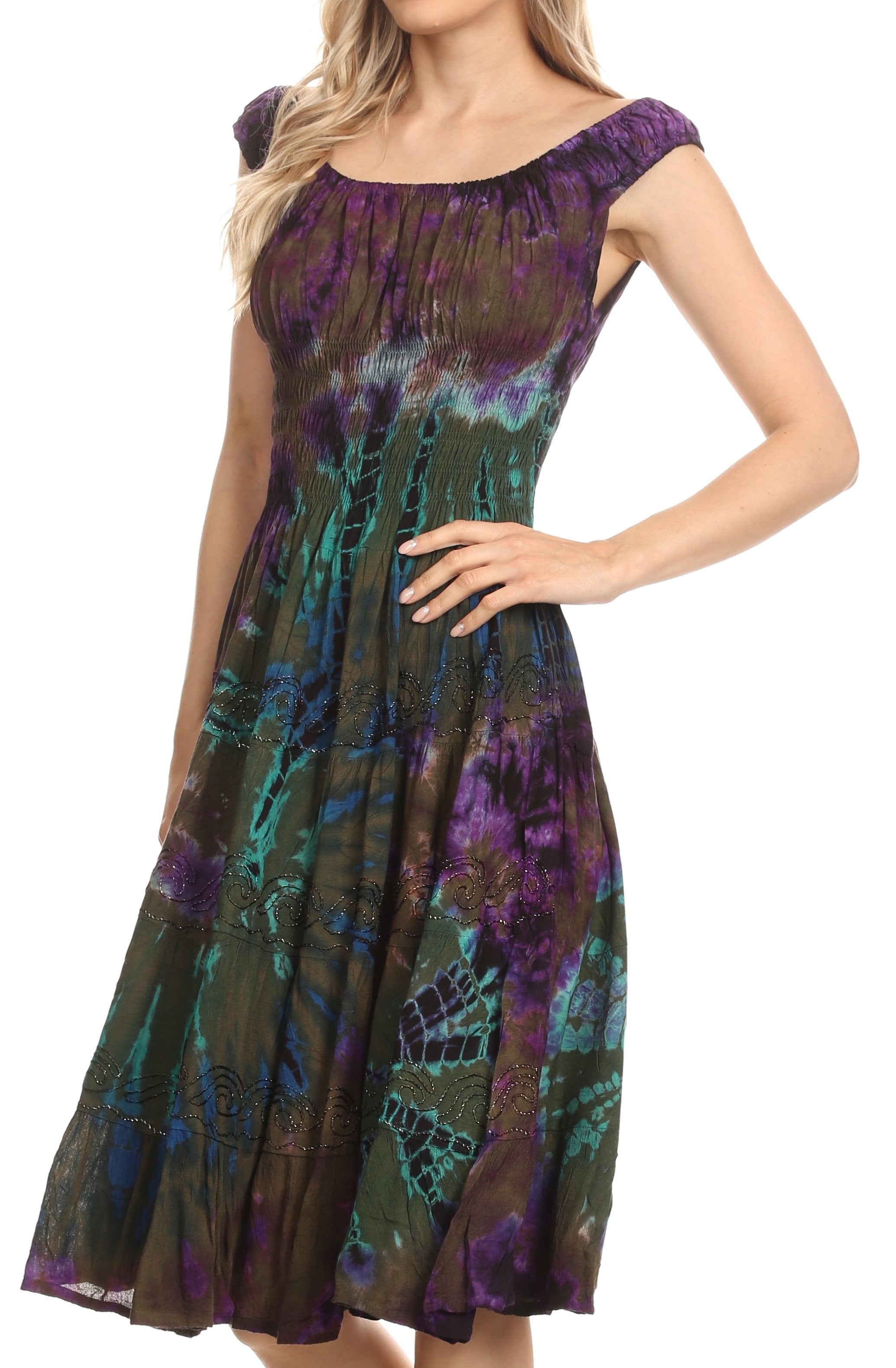Woman wearing a colorful patterned dress on a white background