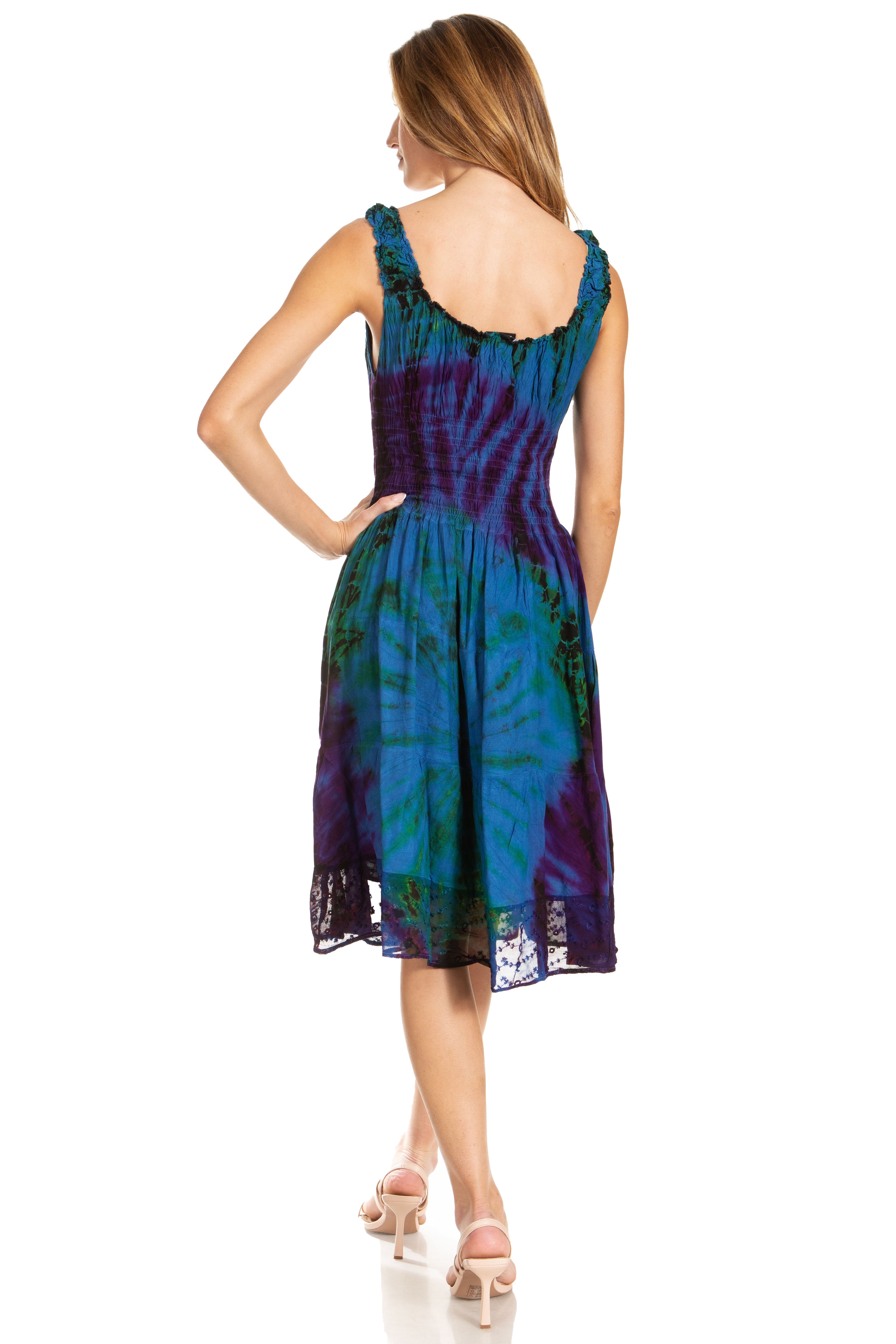 Woman wearing a blue and purple tie-dye dress on a white background