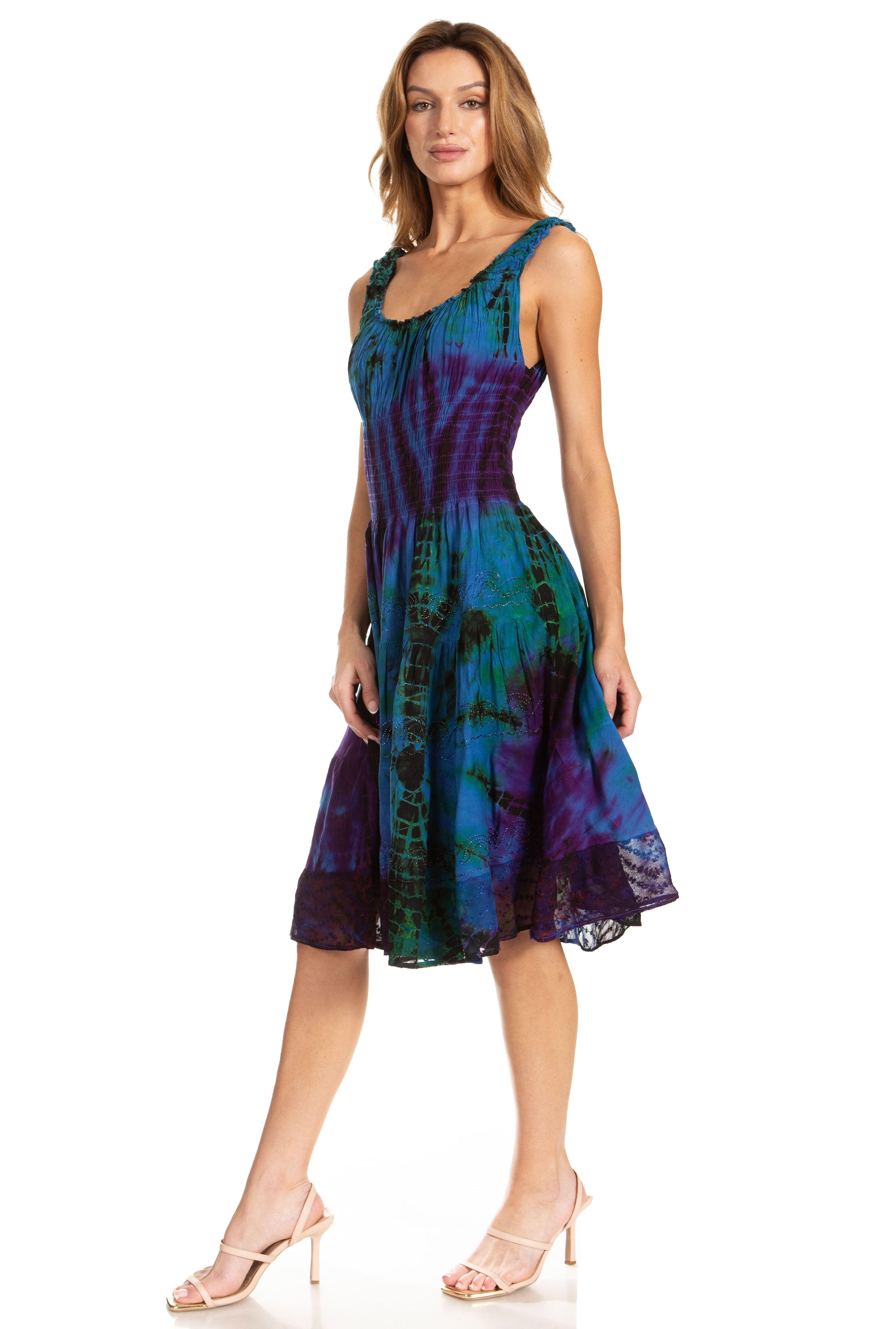 Woman wearing a tie-dye dress on a white background