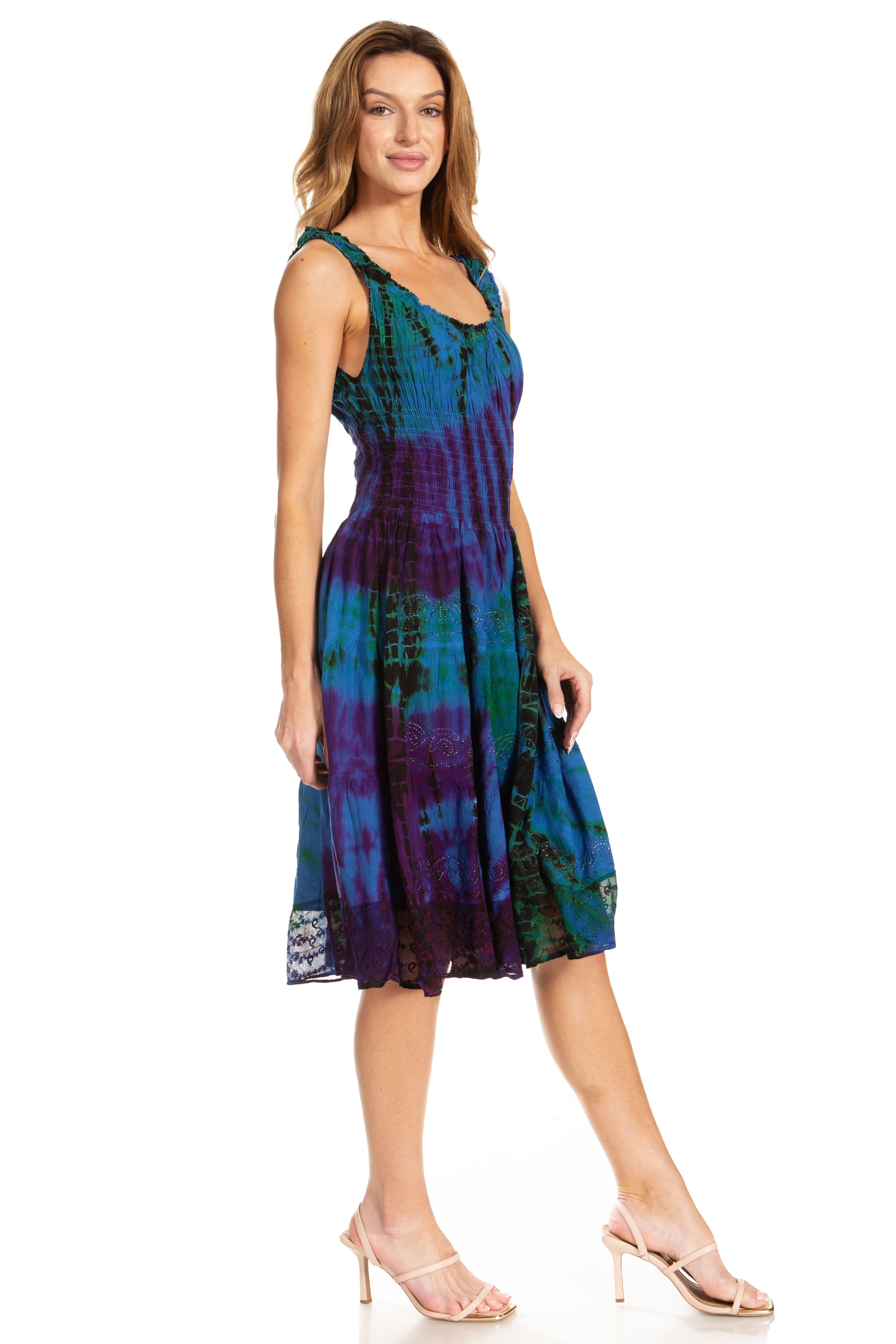 Woman wearing a tie-dye dress on a white background