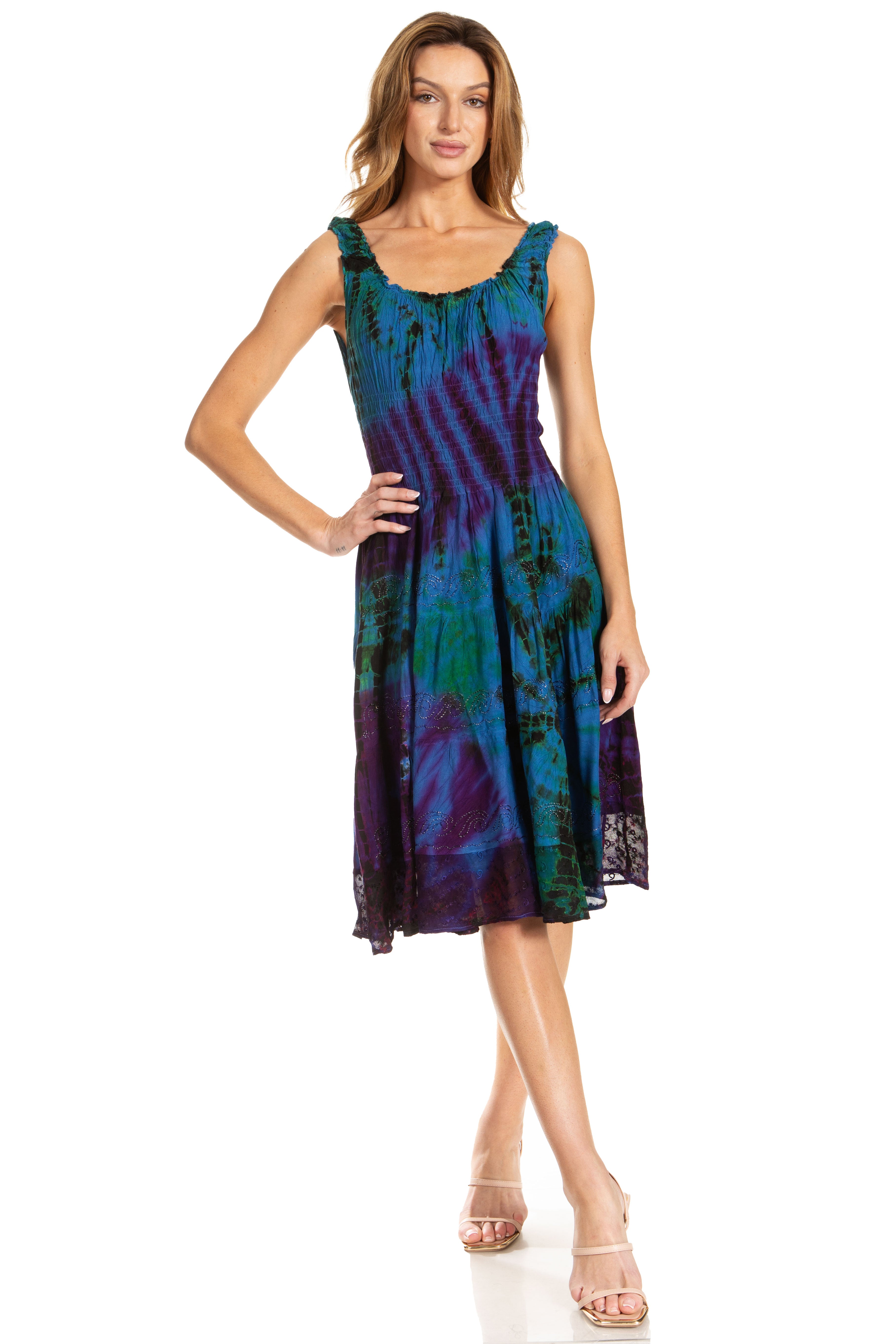 Woman wearing a colorful tie-dye dress on a white background