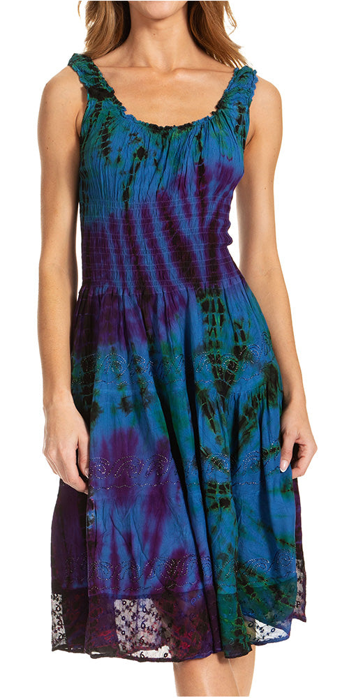 Woman wearing a tie-dye dress with a white background