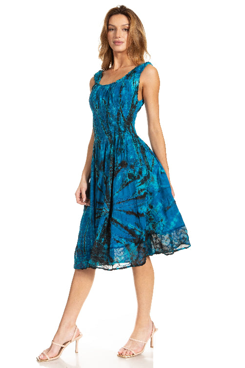 Woman wearing a blue patterned dress on a white background