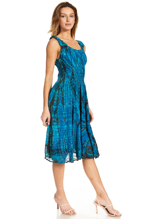 Woman wearing a blue patterned dress on a white background