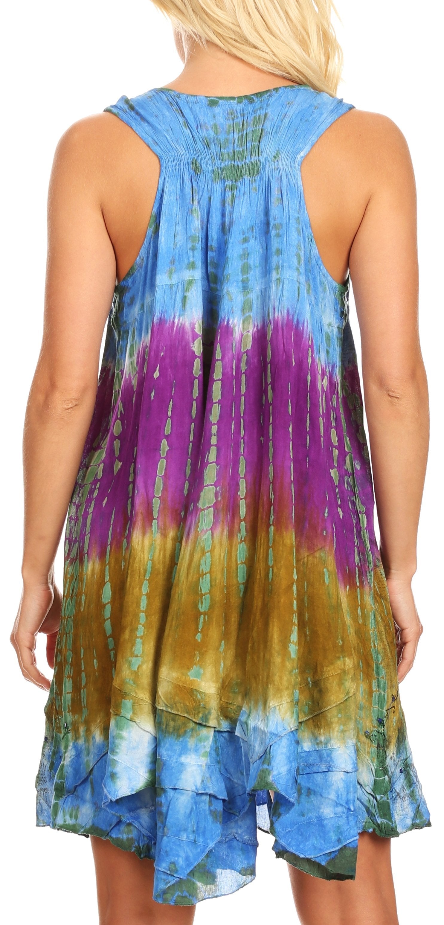 Woman wearing a tie-dye dress with blue, purple, and green colors.