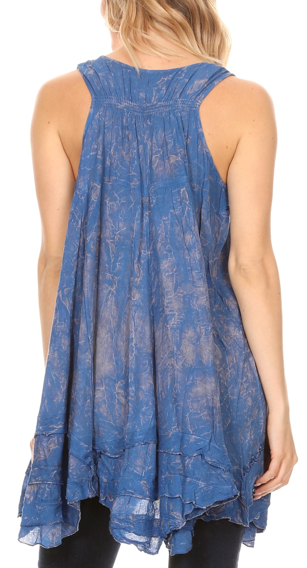 Blue patterned sleeveless top worn by a person on a white background