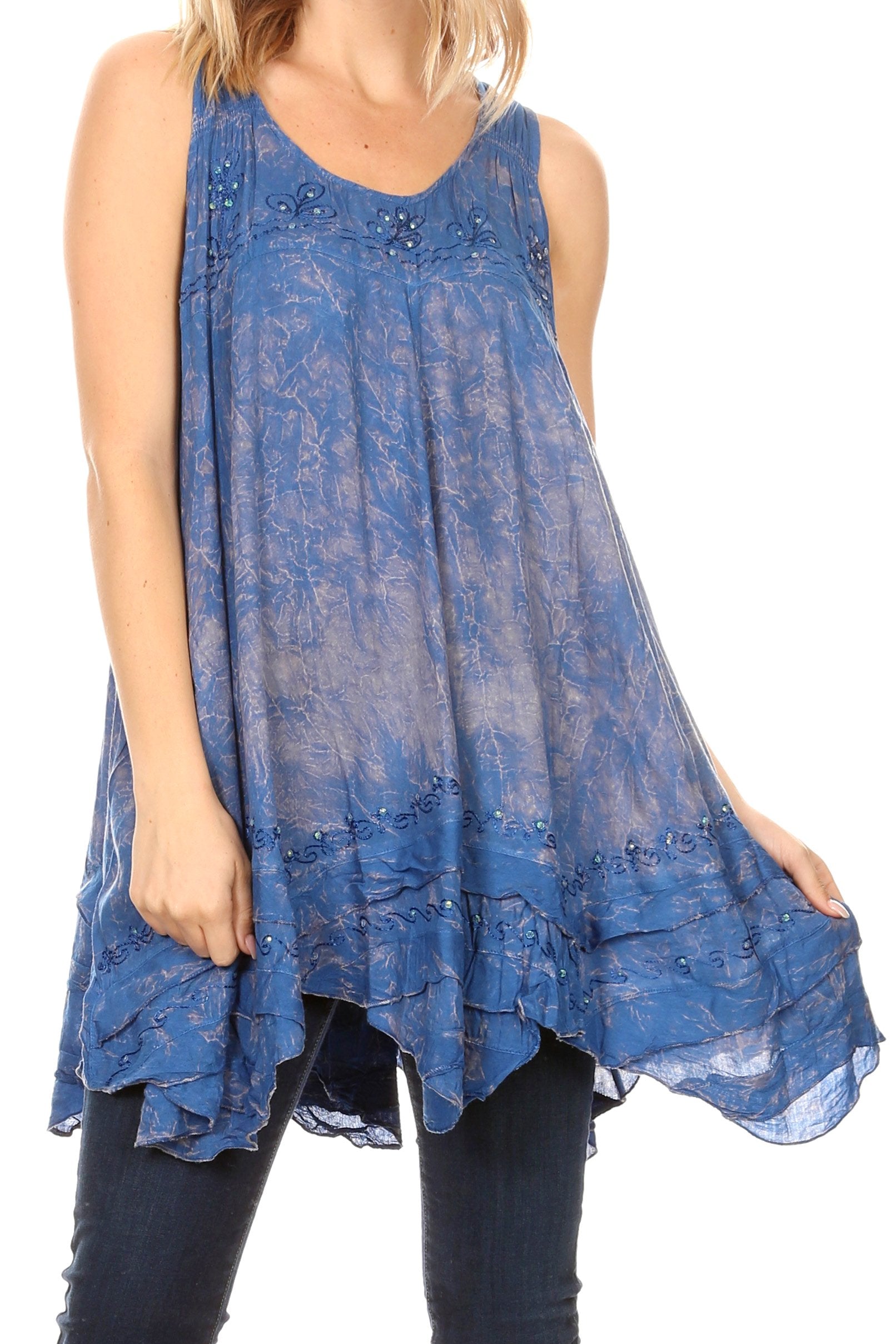 Blue lace sleeveless top worn by a person on a white background
