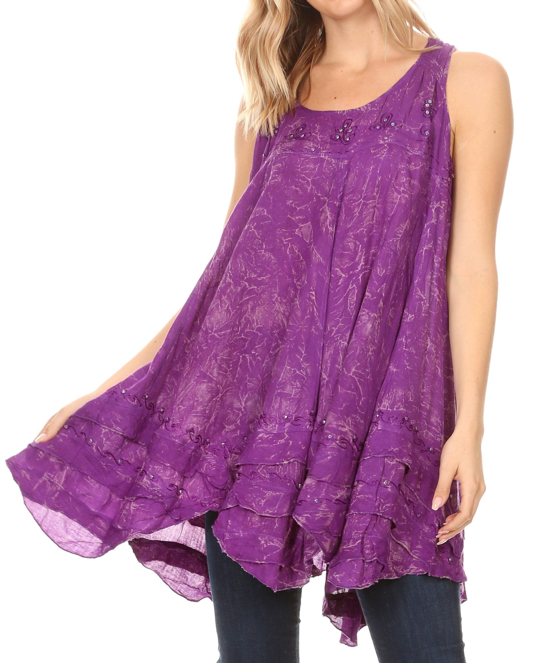 Purple sleeveless top with floral pattern worn by a model on a white background