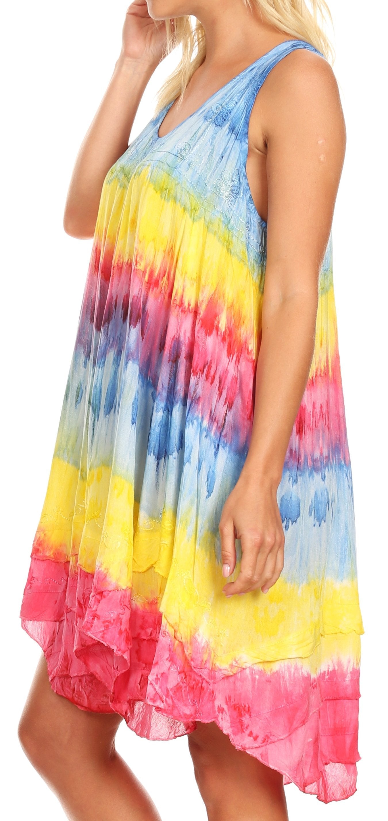 Woman wearing a colorful tie-dye dress with a white background