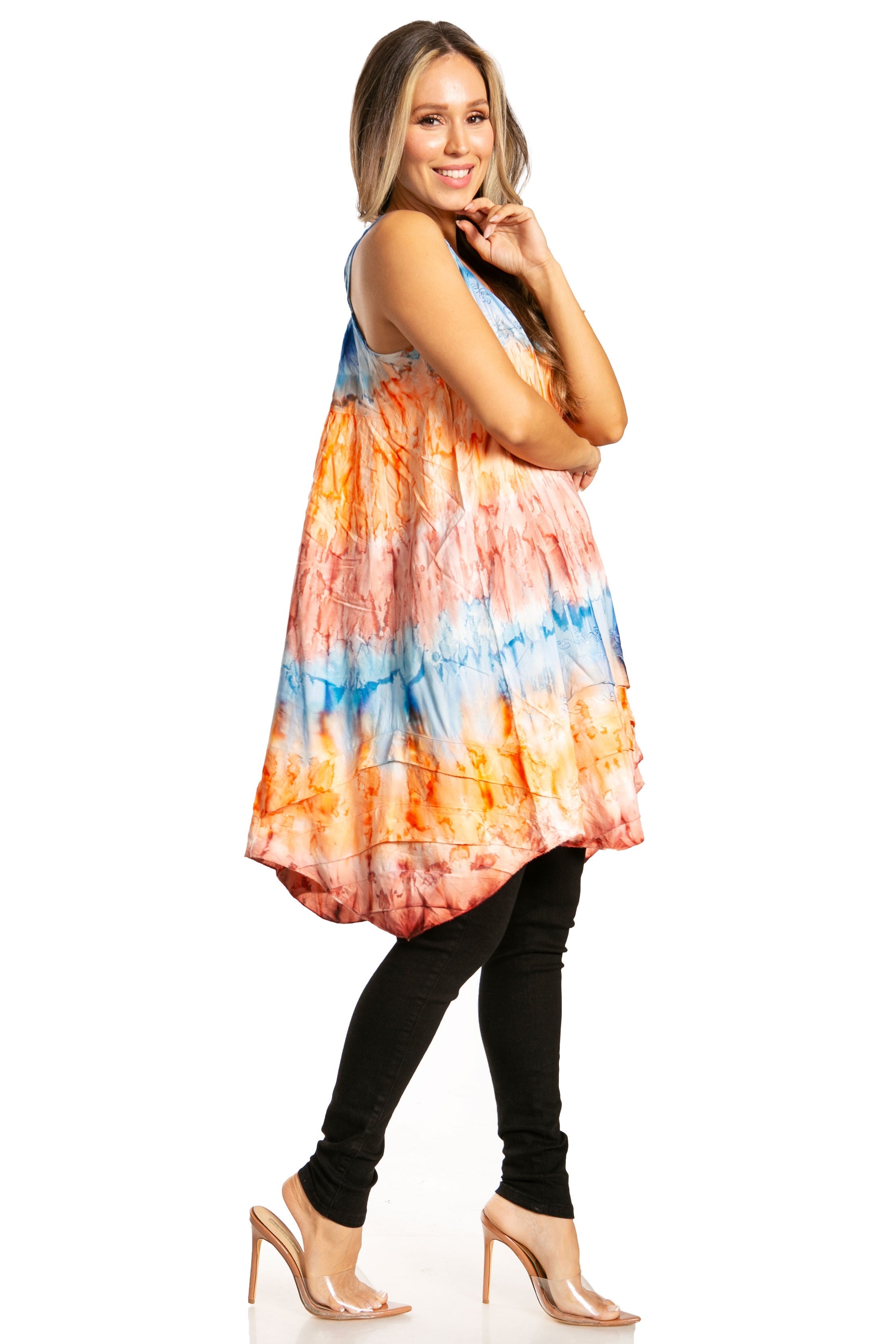 Woman wearing a colorful tie-dye dress on a white background