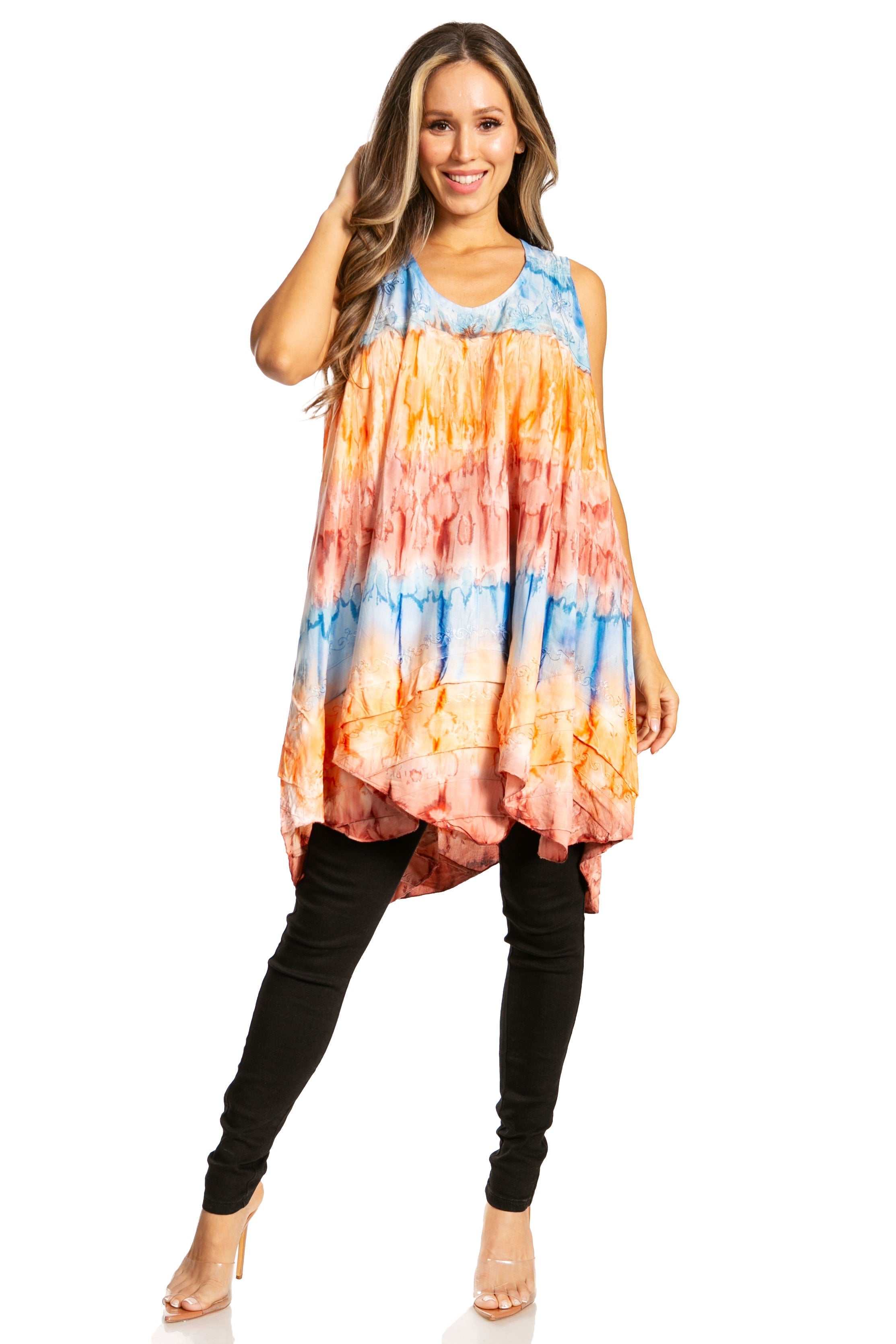 Woman wearing a tie-dye dress with orange, blue, and pink gradient on a white background