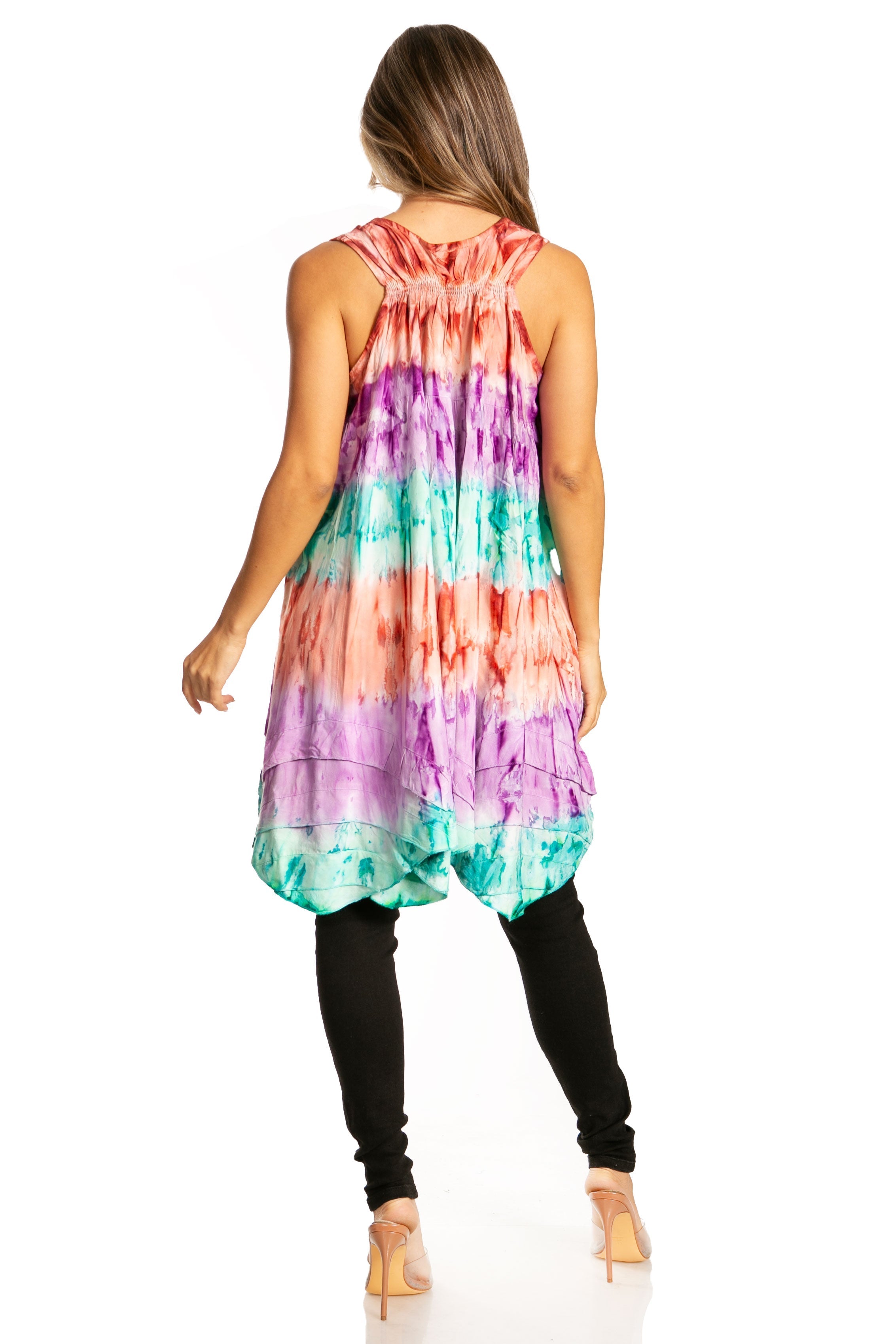 Woman wearing a colorful tie-dye dress on a white background