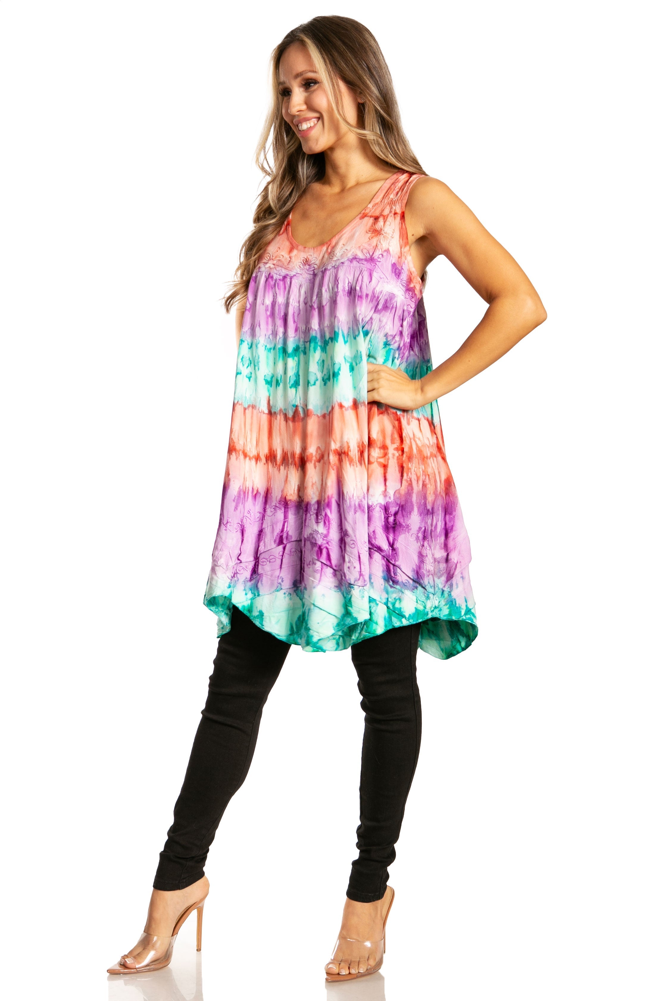 Woman wearing a colorful tie-dye dress on a white background