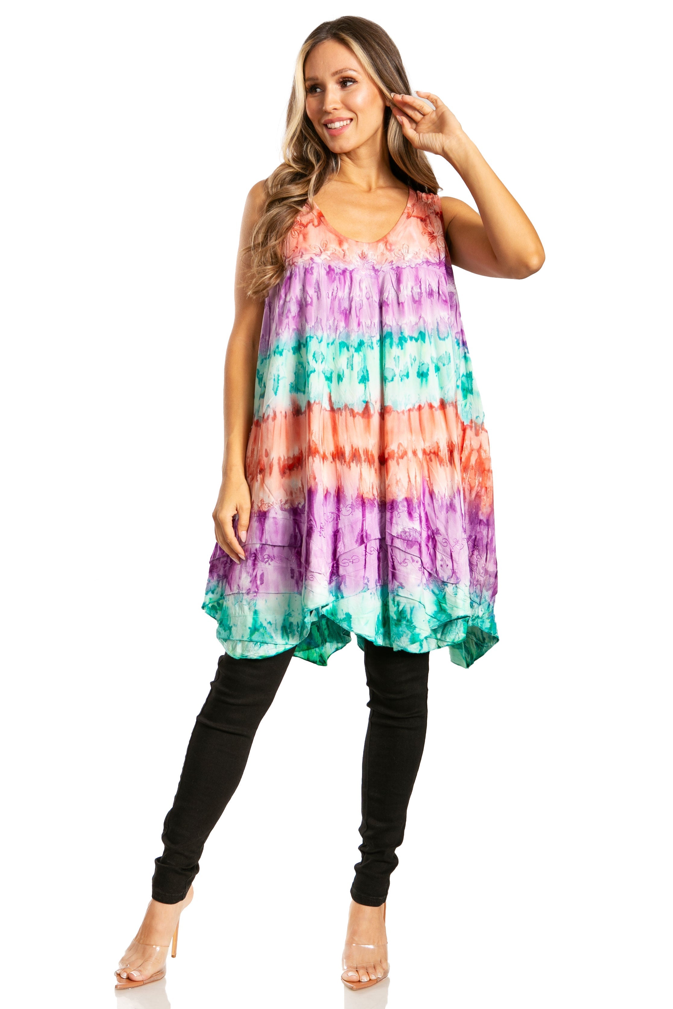 Woman wearing a colorful tie-dye dress on a white background