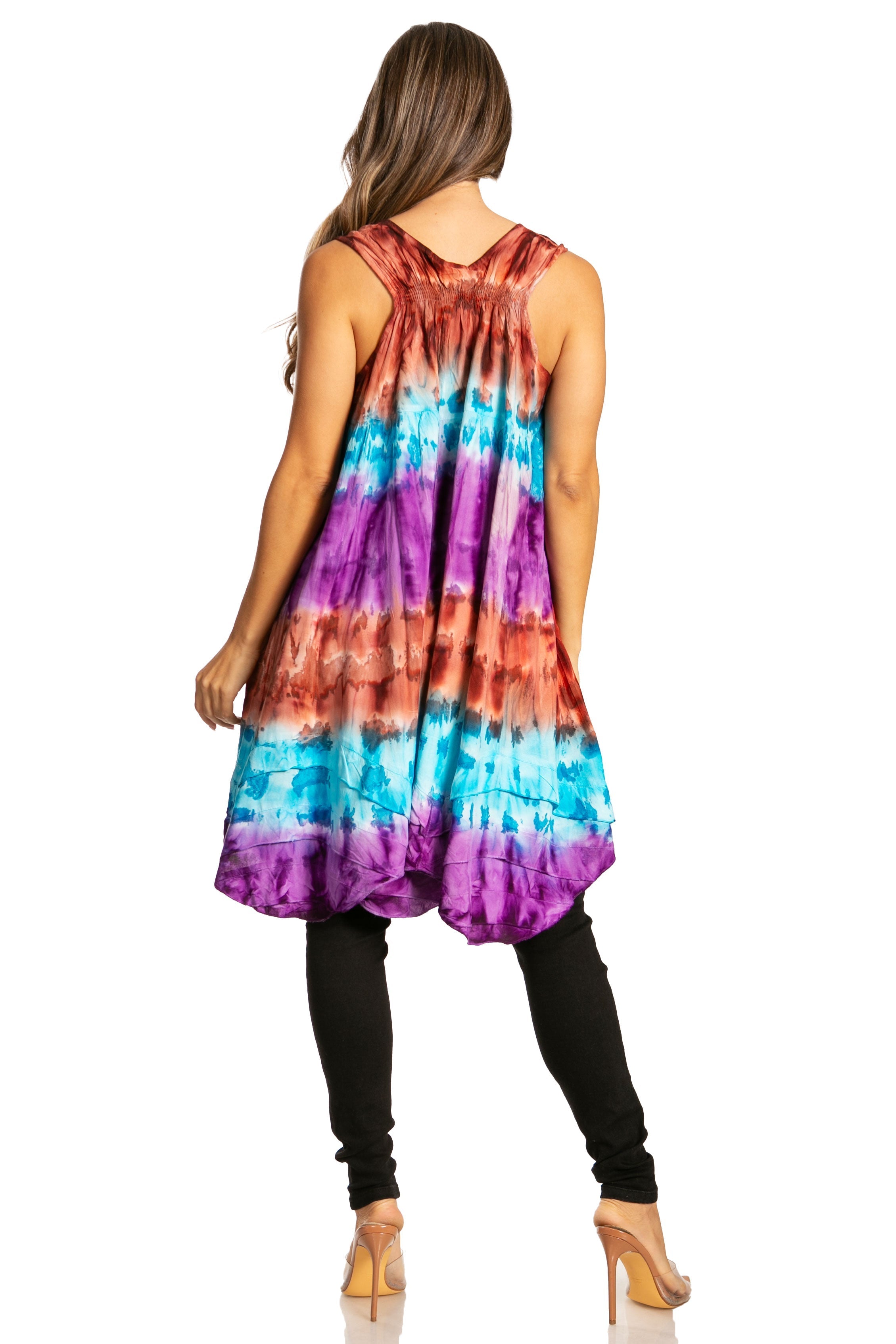Woman wearing a tie-dye dress with a white background