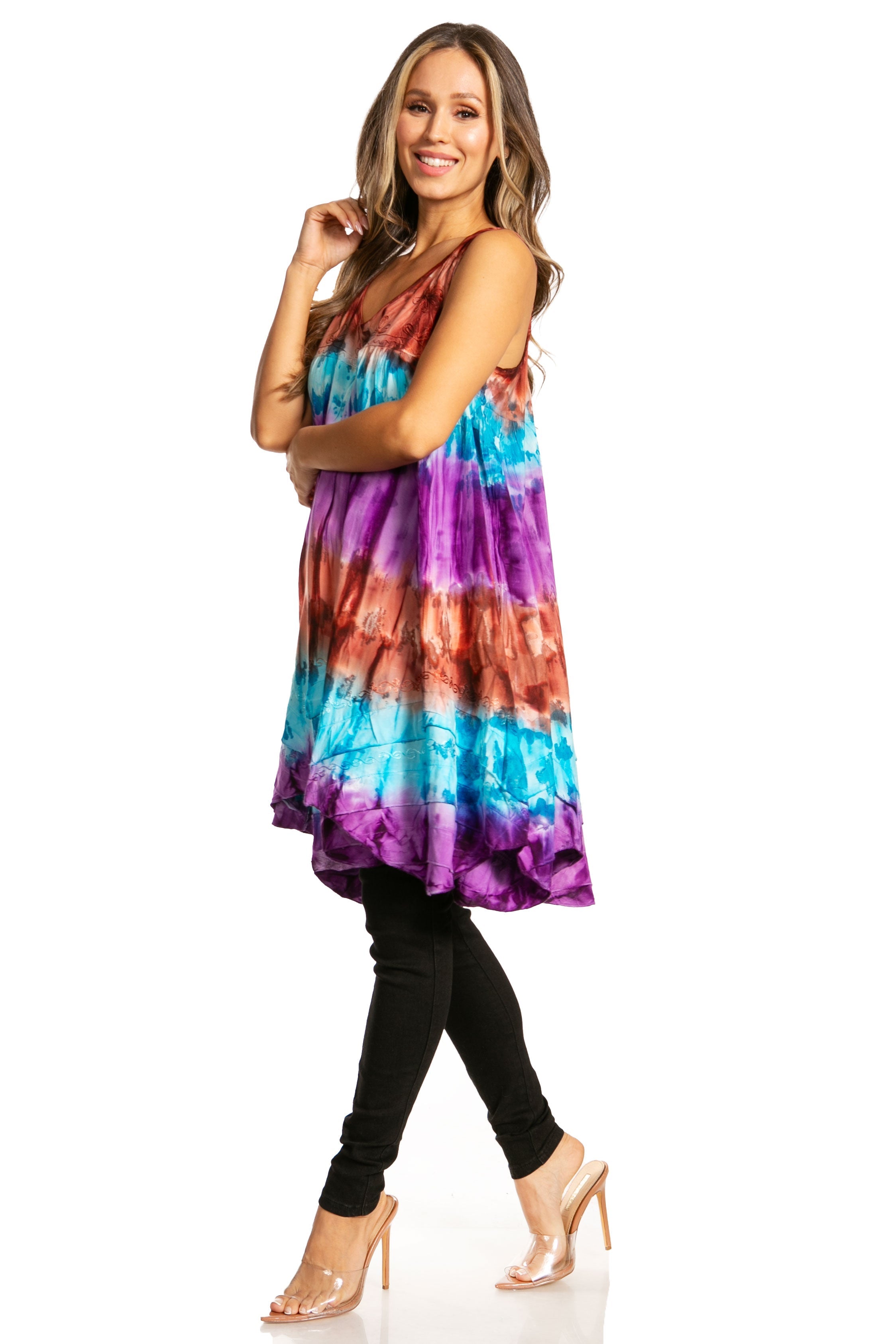 Woman wearing a colorful tie-dye dress on a white background