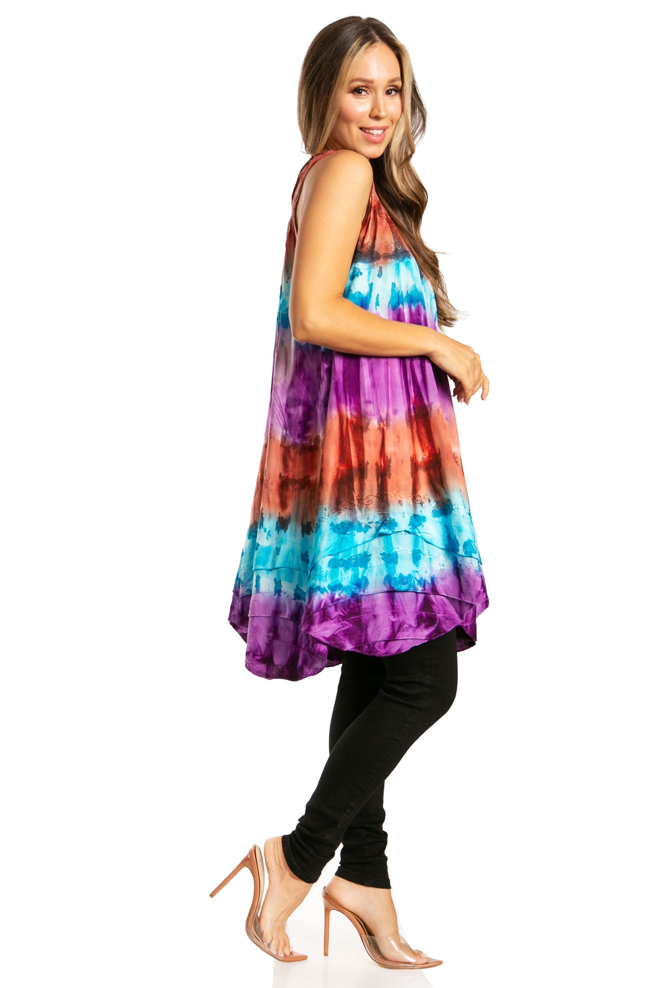 Woman wearing a colorful tie-dye dress on a white background