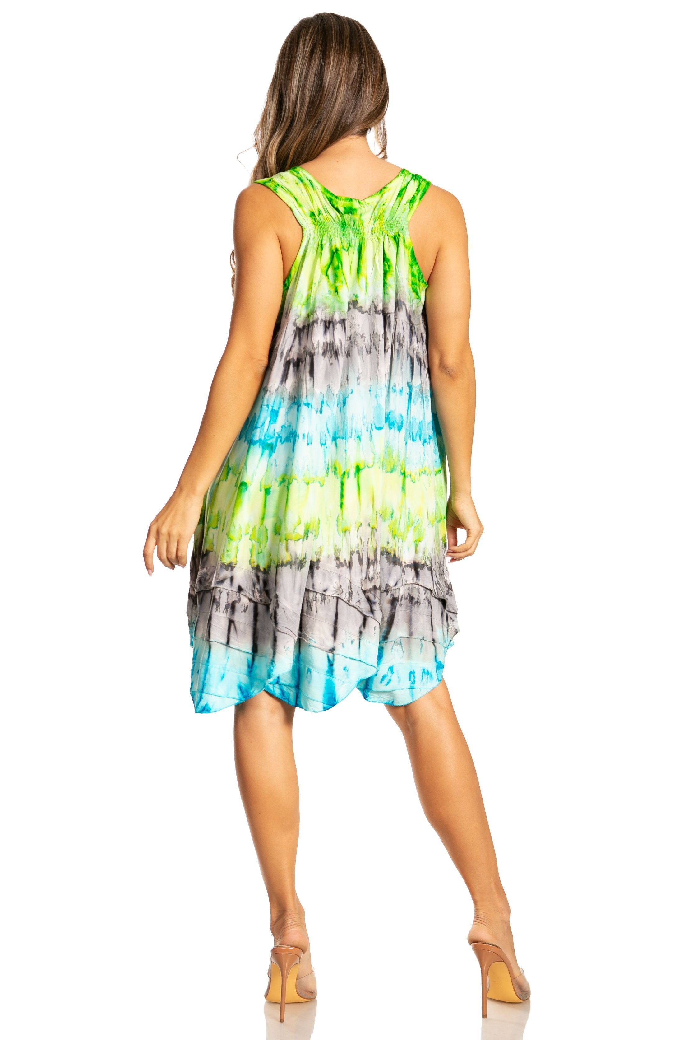 Woman wearing a colorful tie-dye dress on a white background