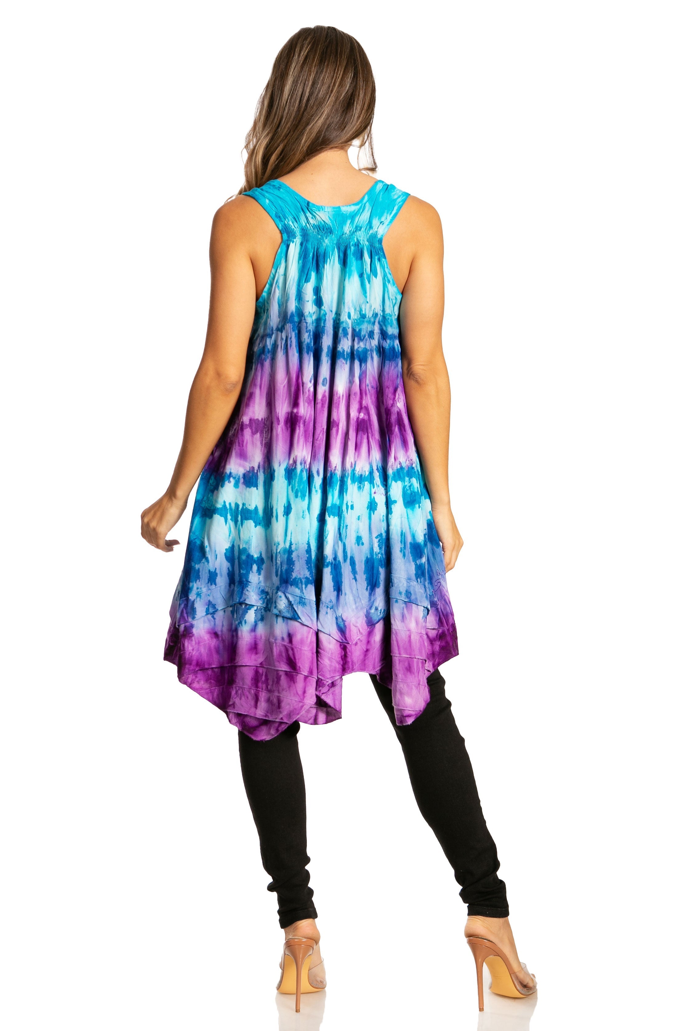 Woman wearing a tie-dye dress with a white background
