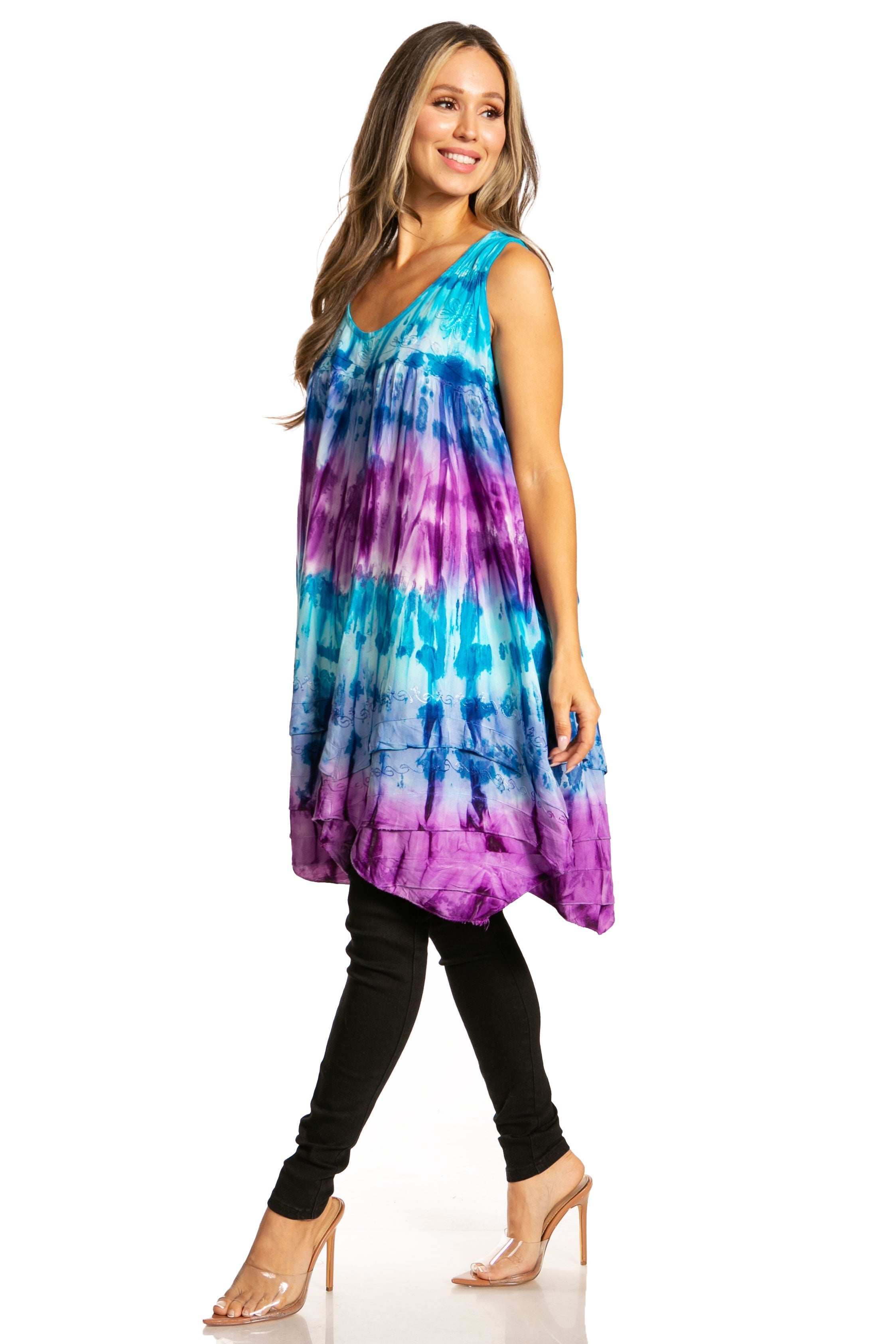 Woman wearing a tie-dye dress with a white background