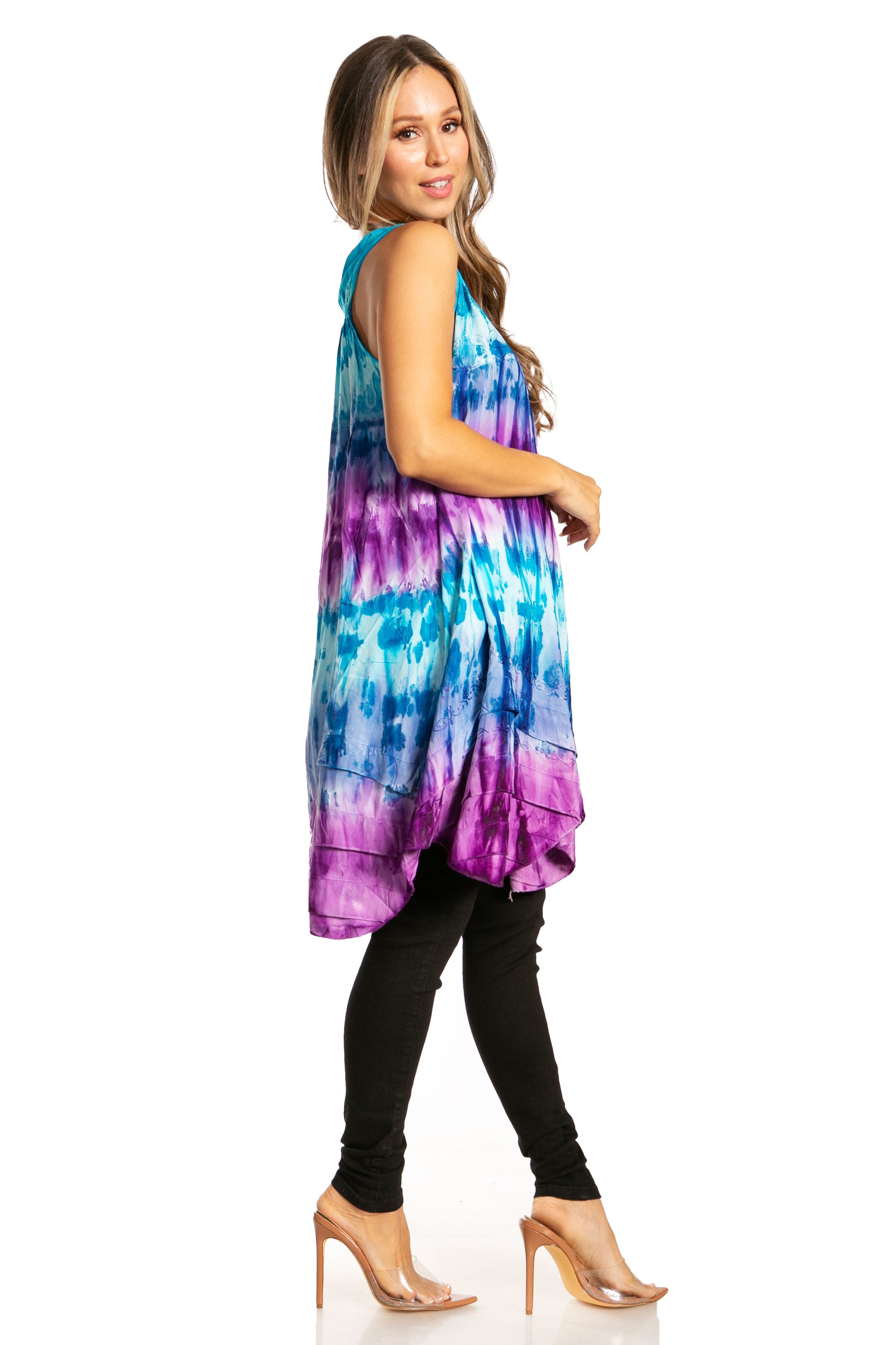 Woman wearing a tie-dye dress with a white background