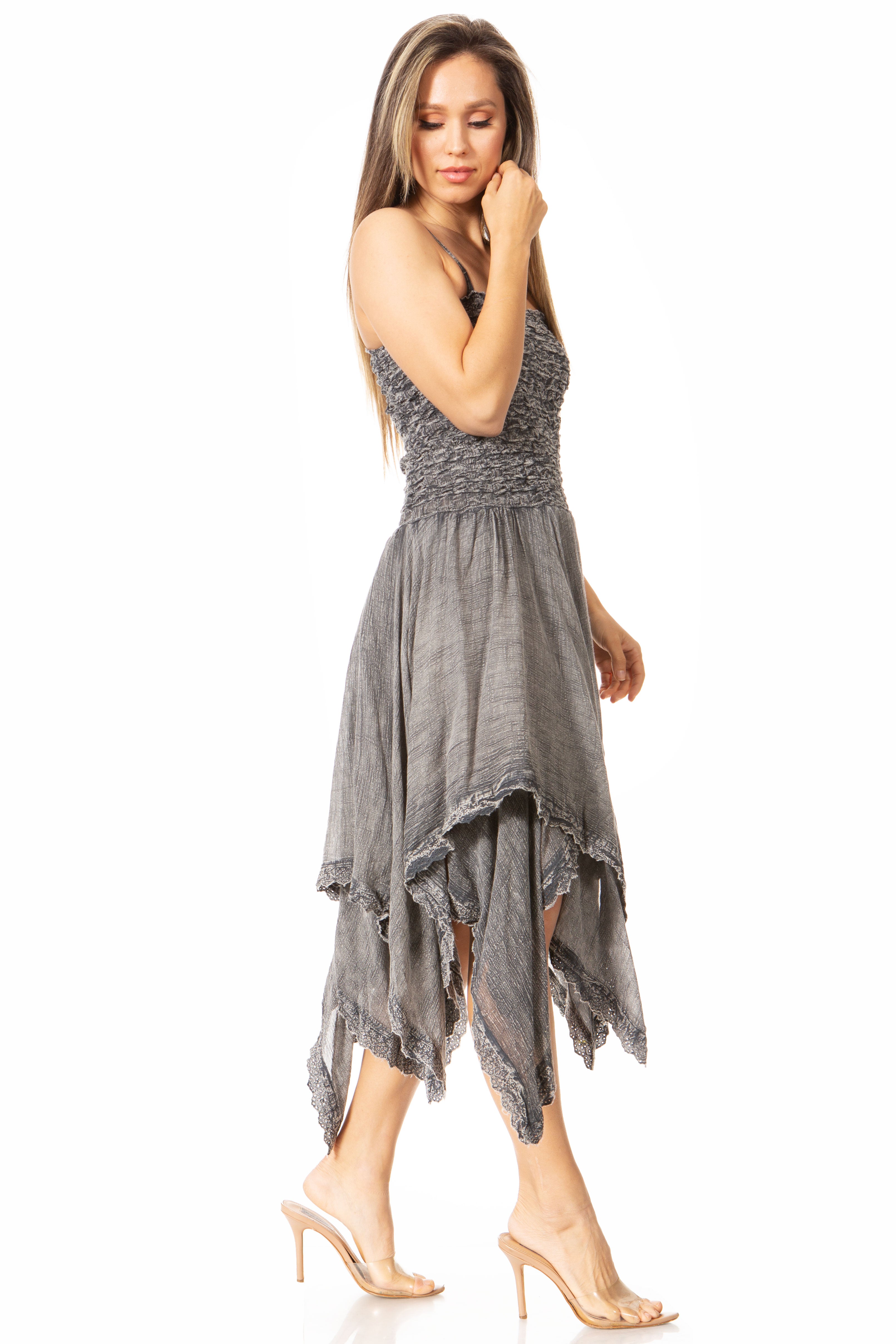 Woman wearing a gray dress on a white background