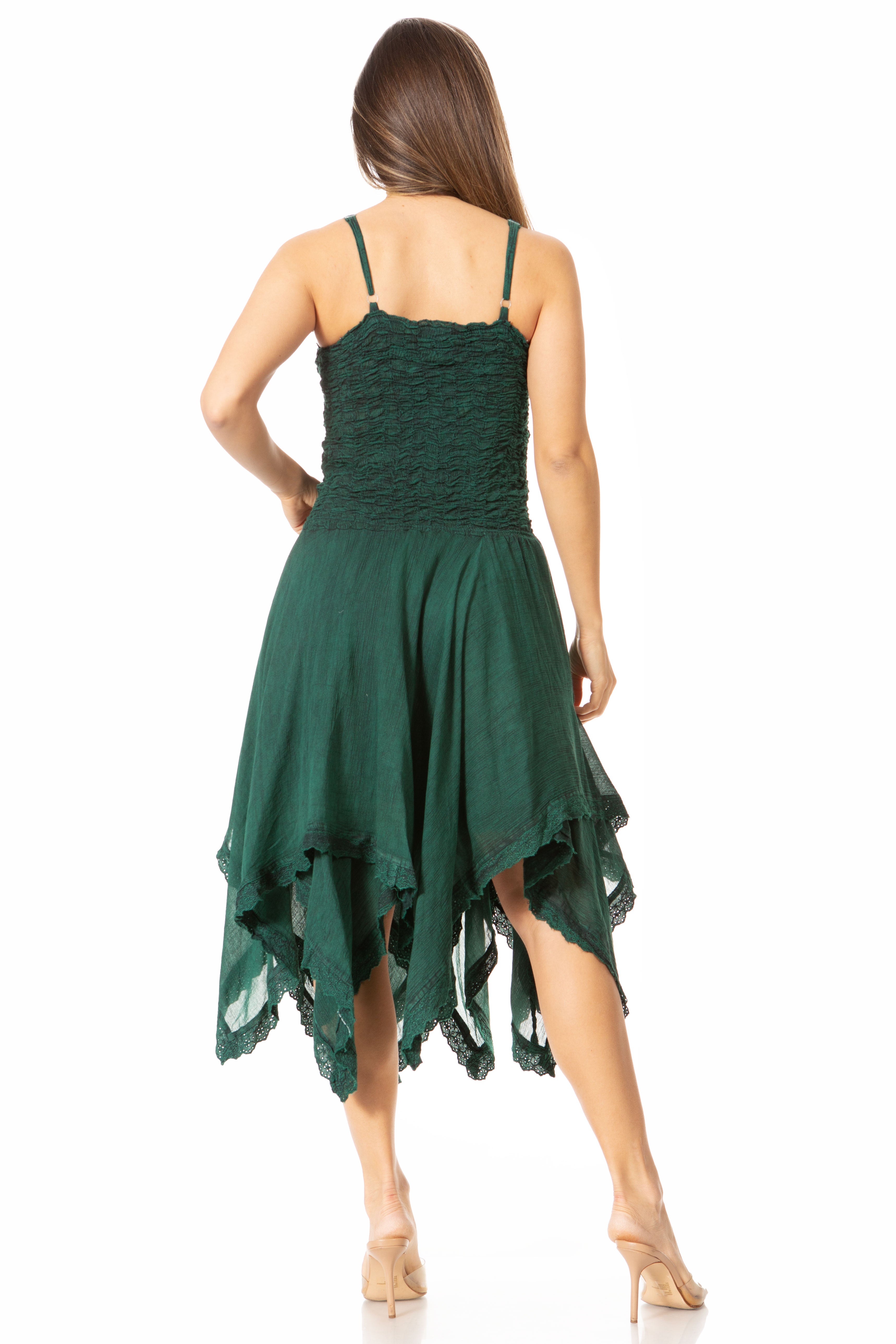 Green dress with a unique hemline on a white background