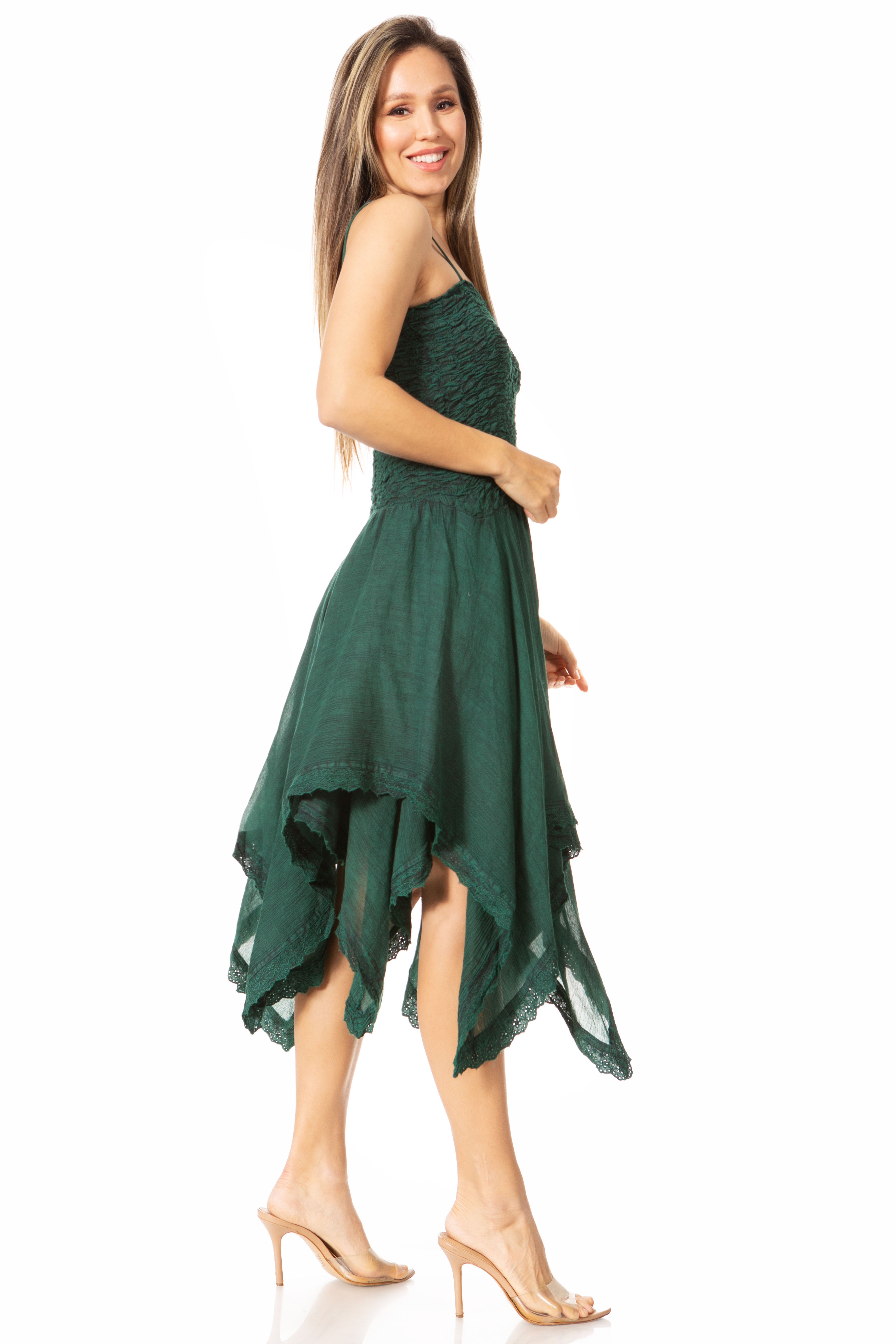 Woman wearing a green strapless dress on a white background