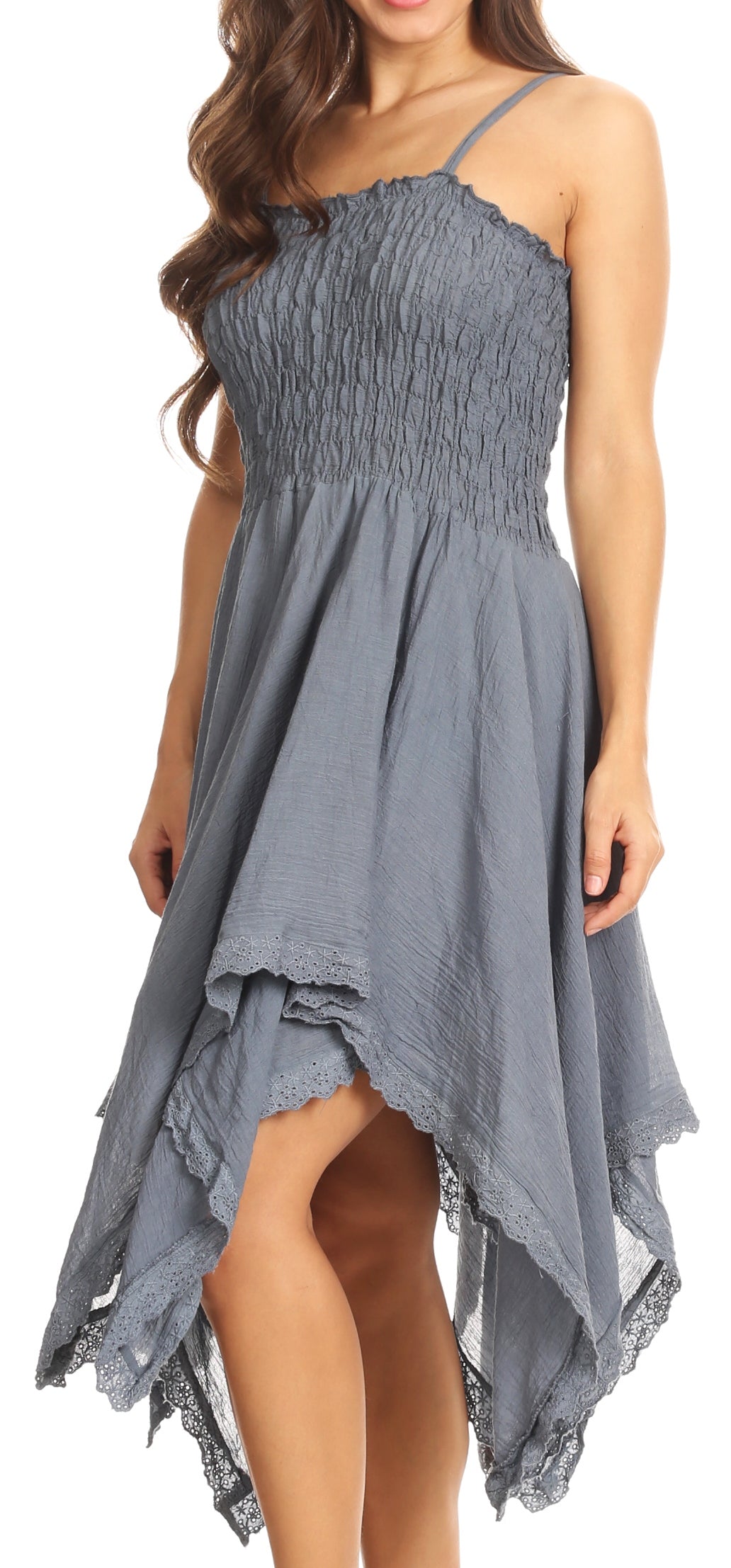 Woman wearing a blue dress with a smocked bodice and layered skirt.