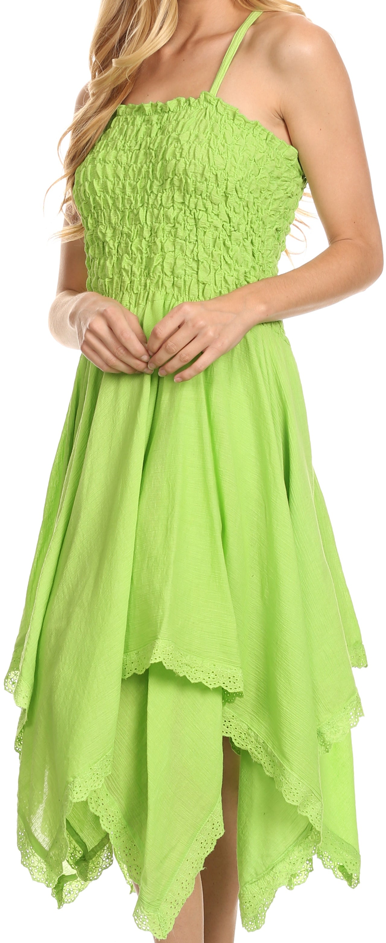 Green dress with a high-low hemline worn by a model.