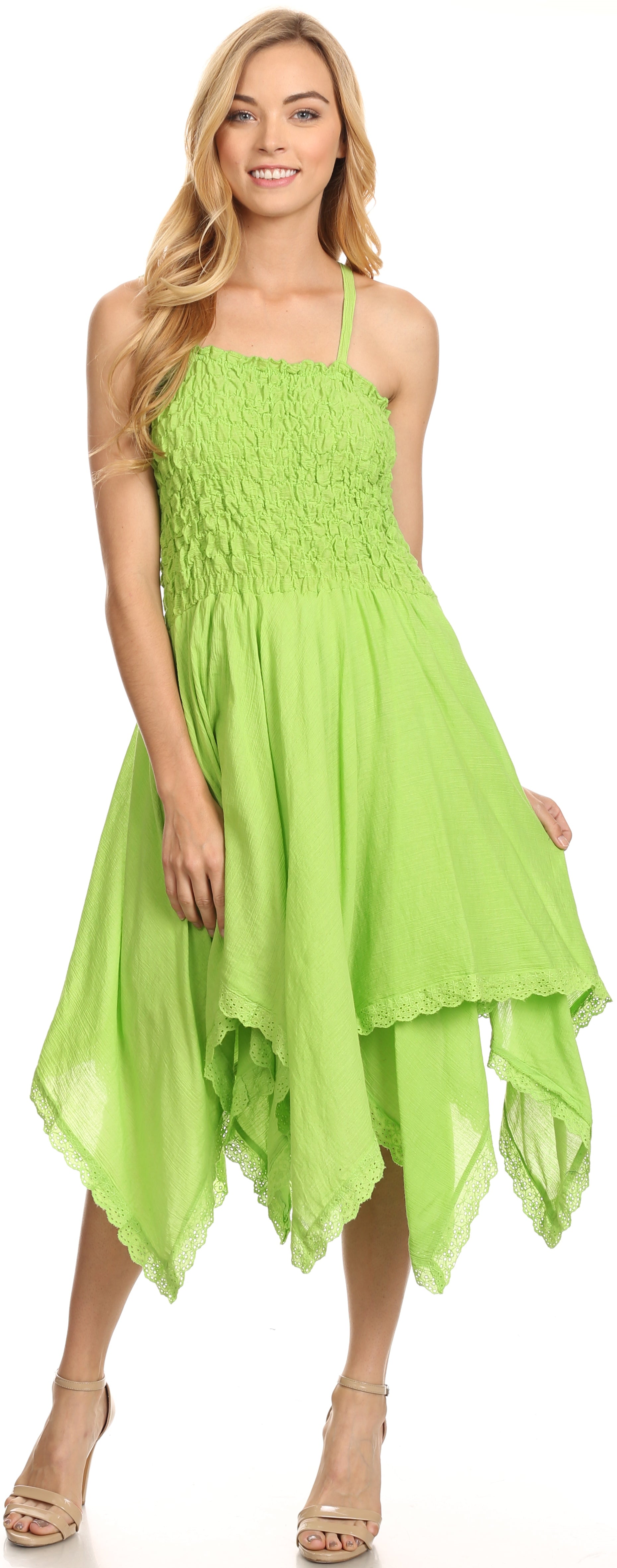 Woman wearing a bright green dress on a white background