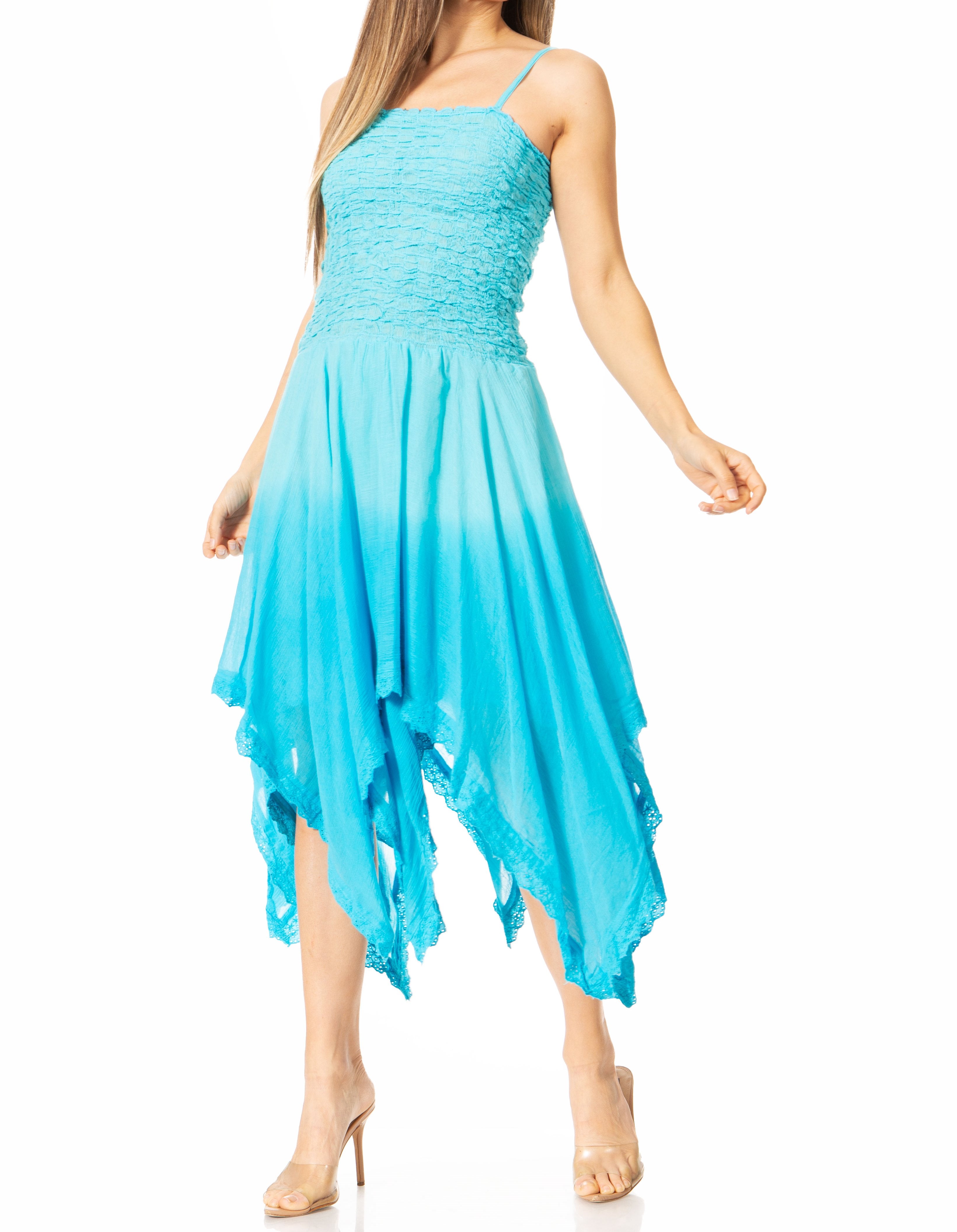 Woman wearing a turquoise dress with a white background