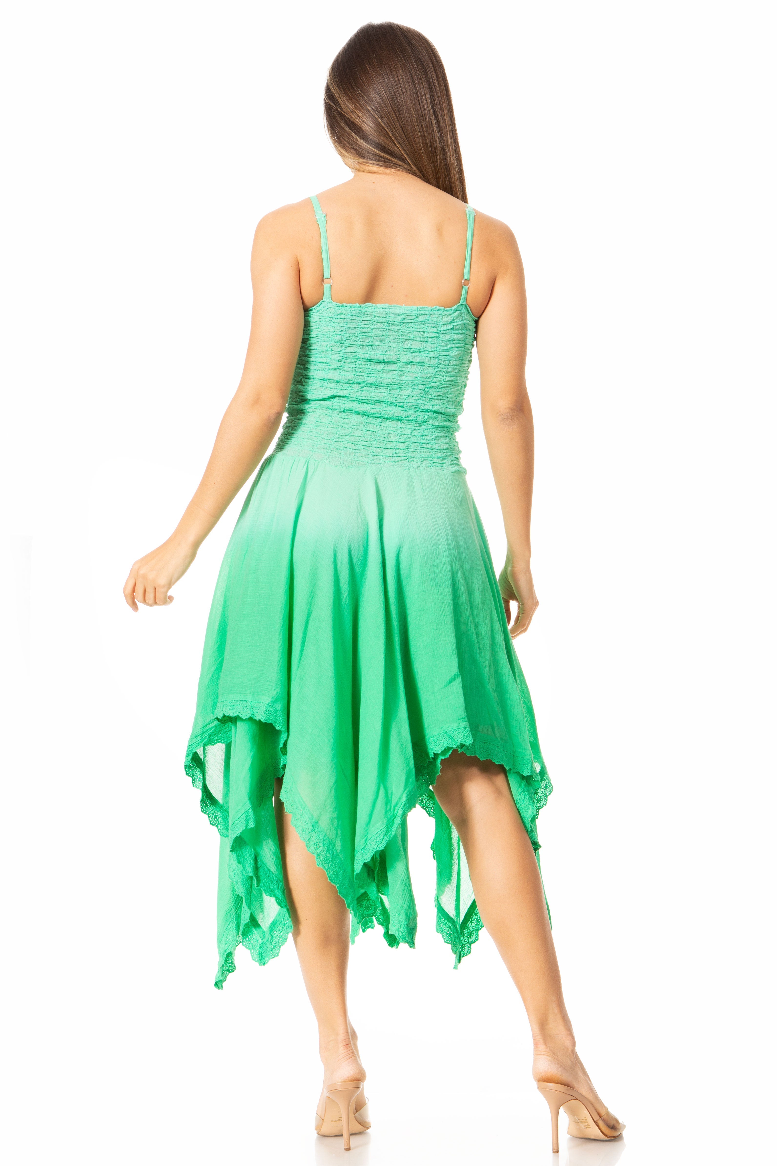 Green dress with a gradient effect worn by a model on a white background