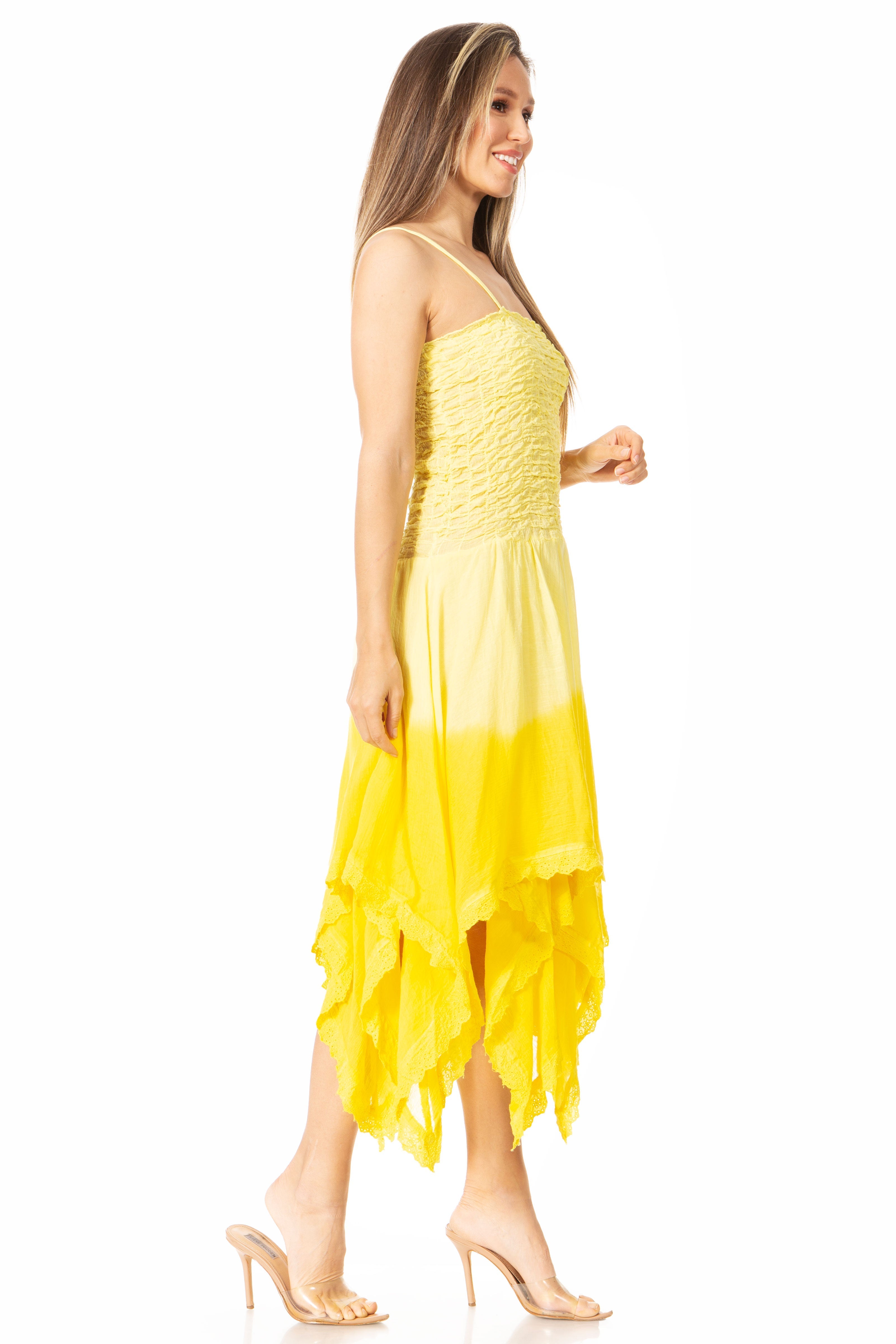 Woman wearing a yellow dress with a gradient effect on a white background