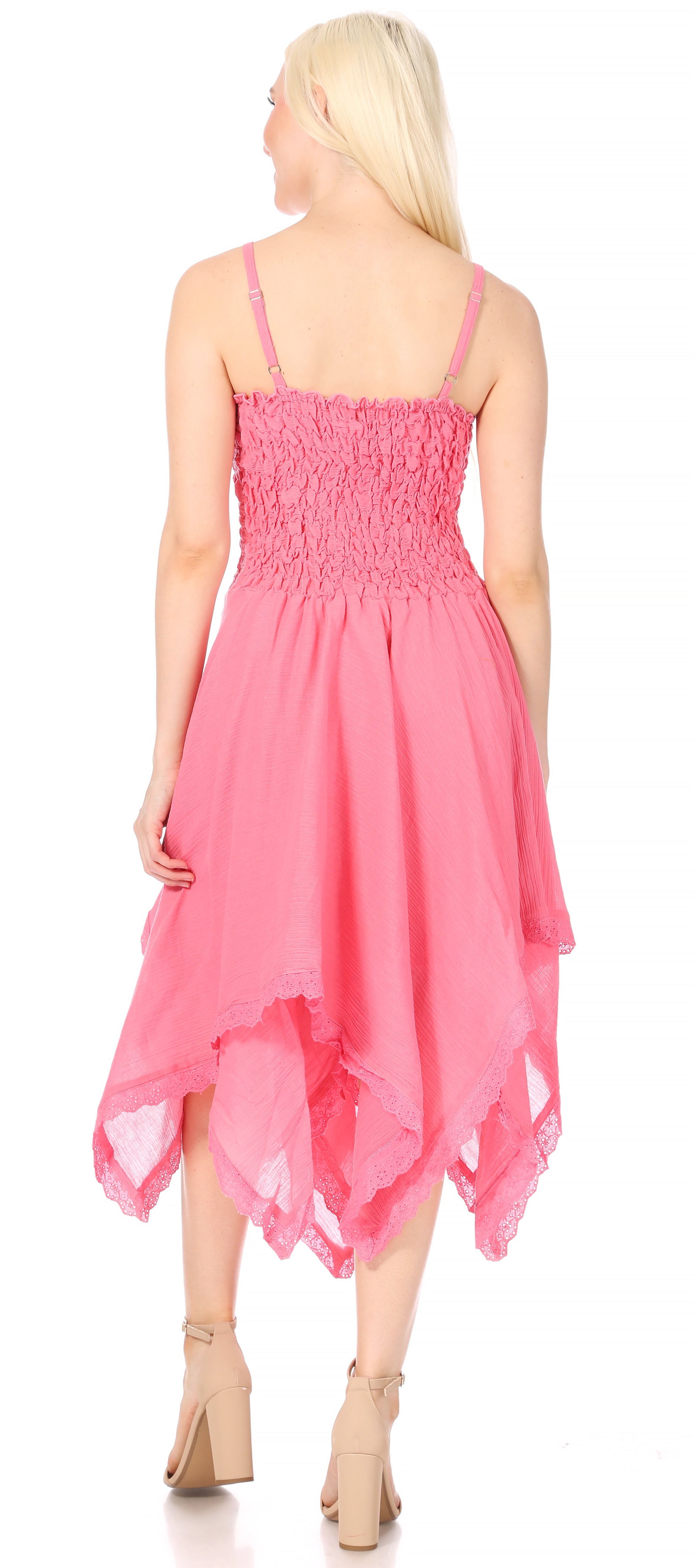 Woman wearing a pink dress with a white background