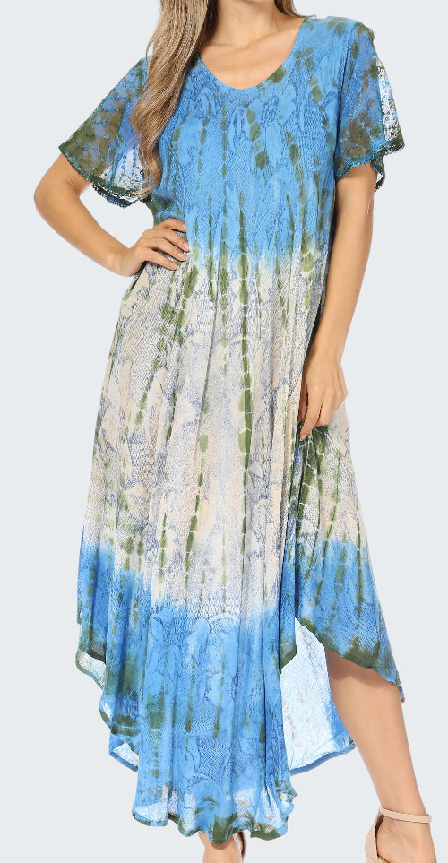 Woman wearing a blue and green patterned dress on a white background