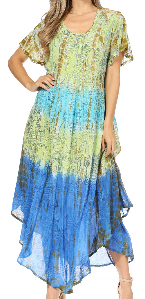 Woman wearing a colorful dress with a gradient from green to blue on a white background