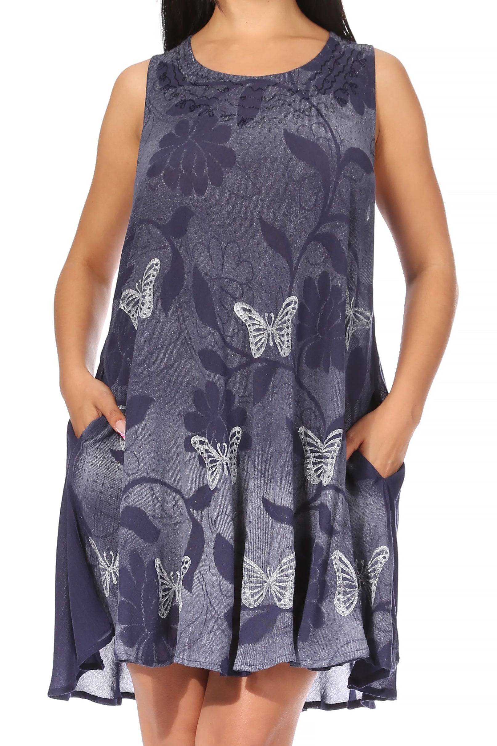 Woman wearing a sleeveless dress with butterfly pattern on a plain background