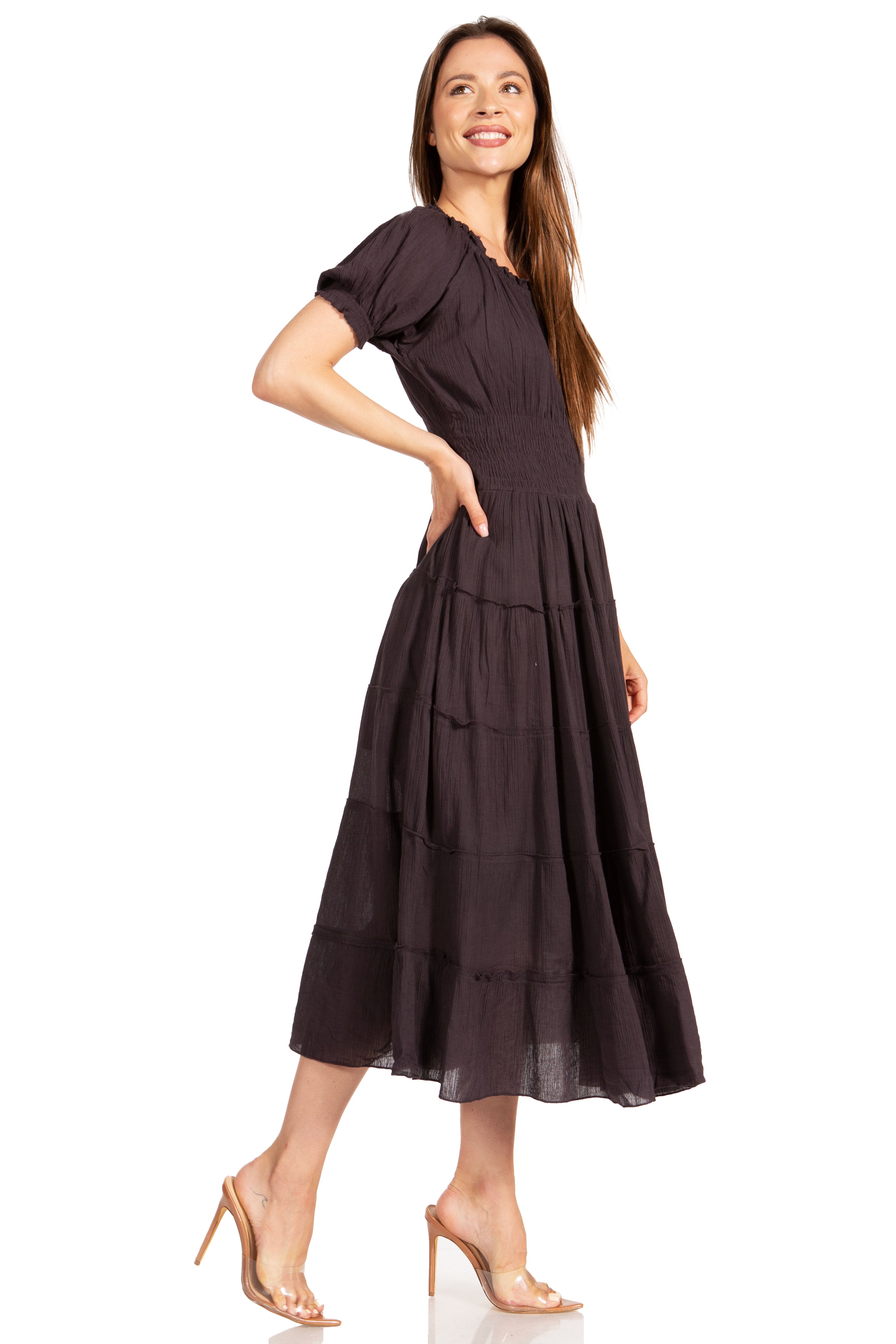 Woman wearing a dark brown dress on a white background